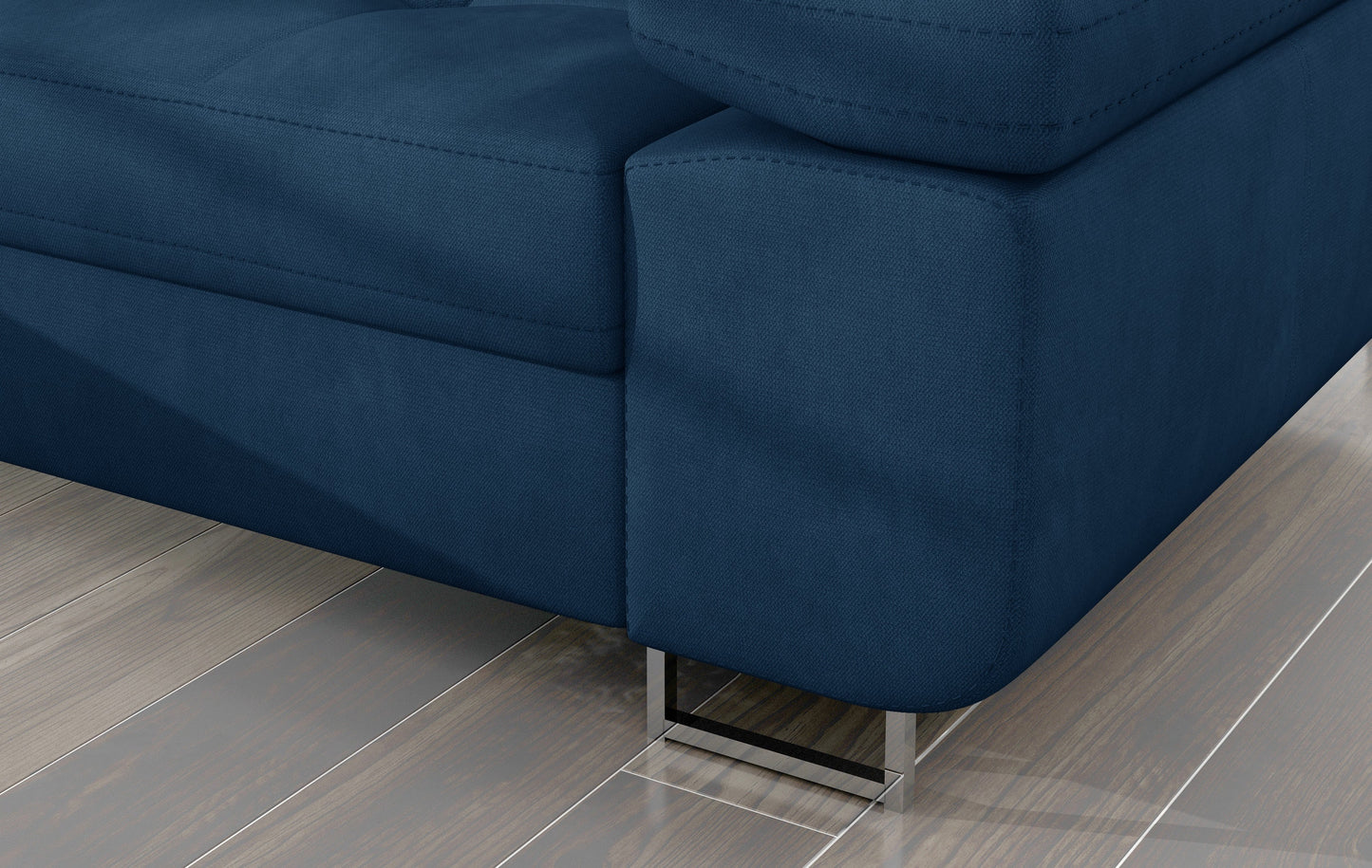 Detal narożnika Armando: granatowa tkanina Kronos 09 i metalowa noga – widok narożnika z perspektywy podłogi.
