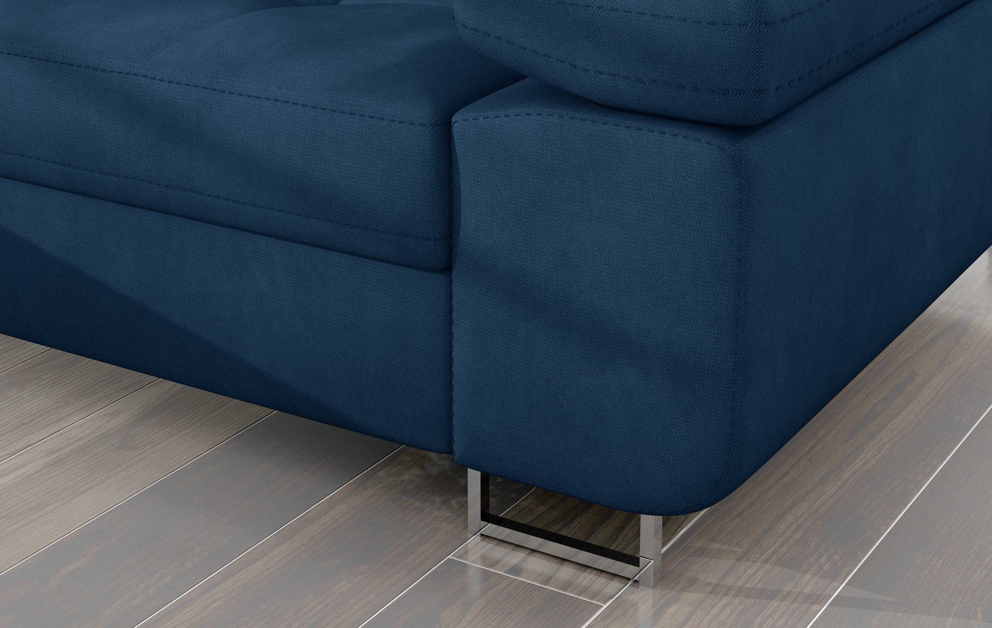Detal narożnika Armando: granatowa tkanina Kronos 09 i metalowa noga – widok narożnika z perspektywy podłogi.