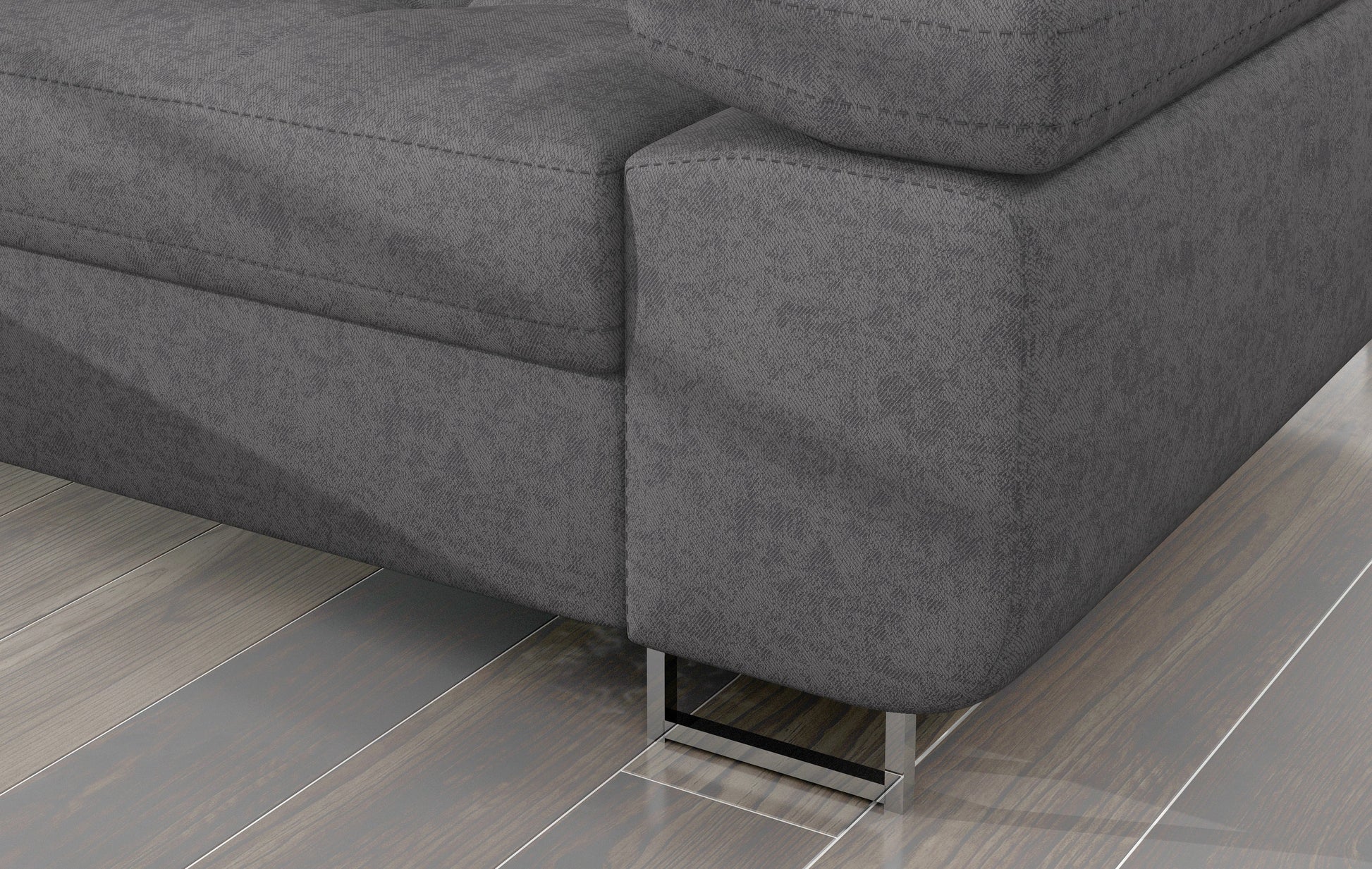 Detal narożnika Armando: szara tkanina Gusto 88 i metalowa noga – widok narożnika z perspektywy podłogi.
