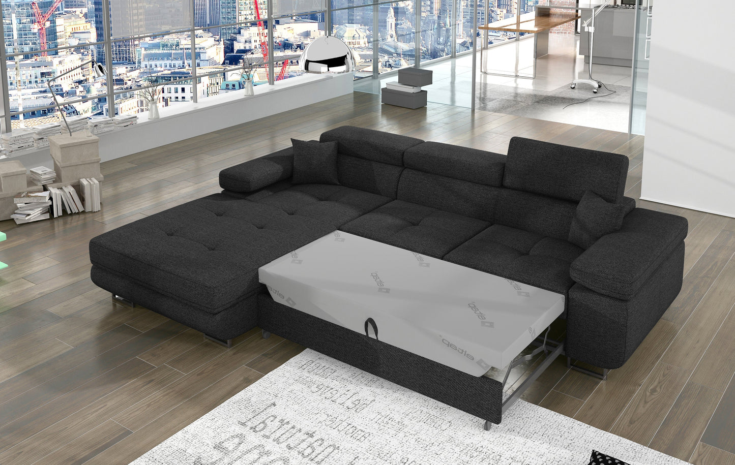 Narożnik Armando Inari 96 ciemnoszary – prezentacja funkcji spania z wysuniętym mechanizmem, ujęcie z góry.