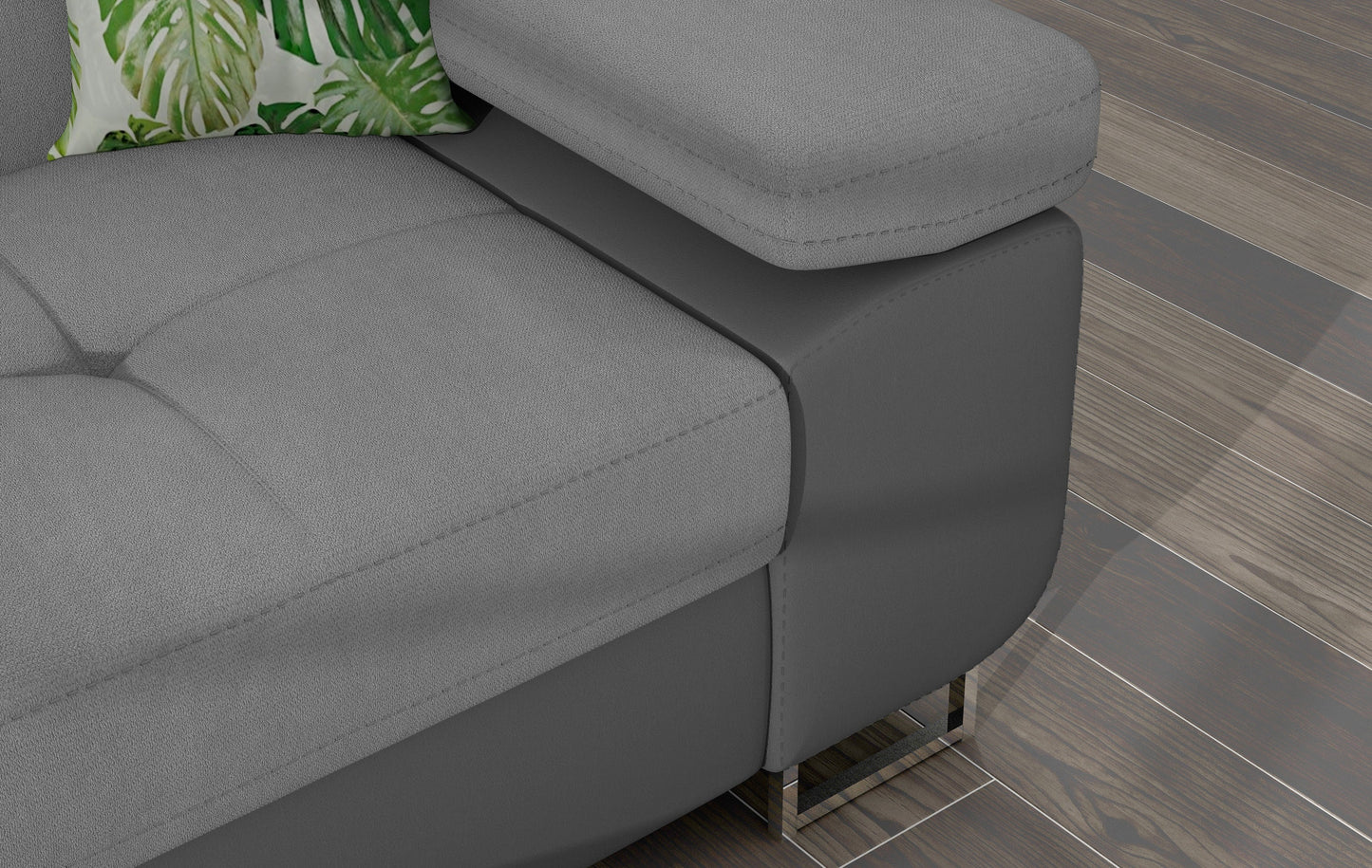 Zbliżenie na podłokietnik narożnika Armando w tkaninie Soro 83 jasnoszary z szarą podstawą Soft 29 i poduszką Jungle 32.