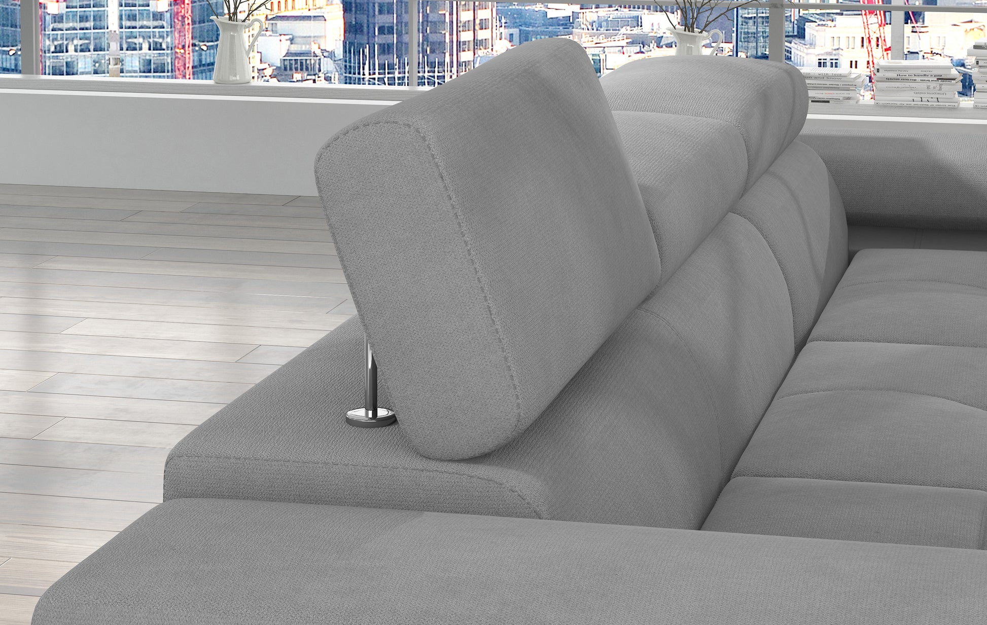 Regulowany zagłówek narożnika Armando w tkaninie Soro 83 jasnoszary – detal mechanizmu i poduszki dekoracyjnej Jungle 32.