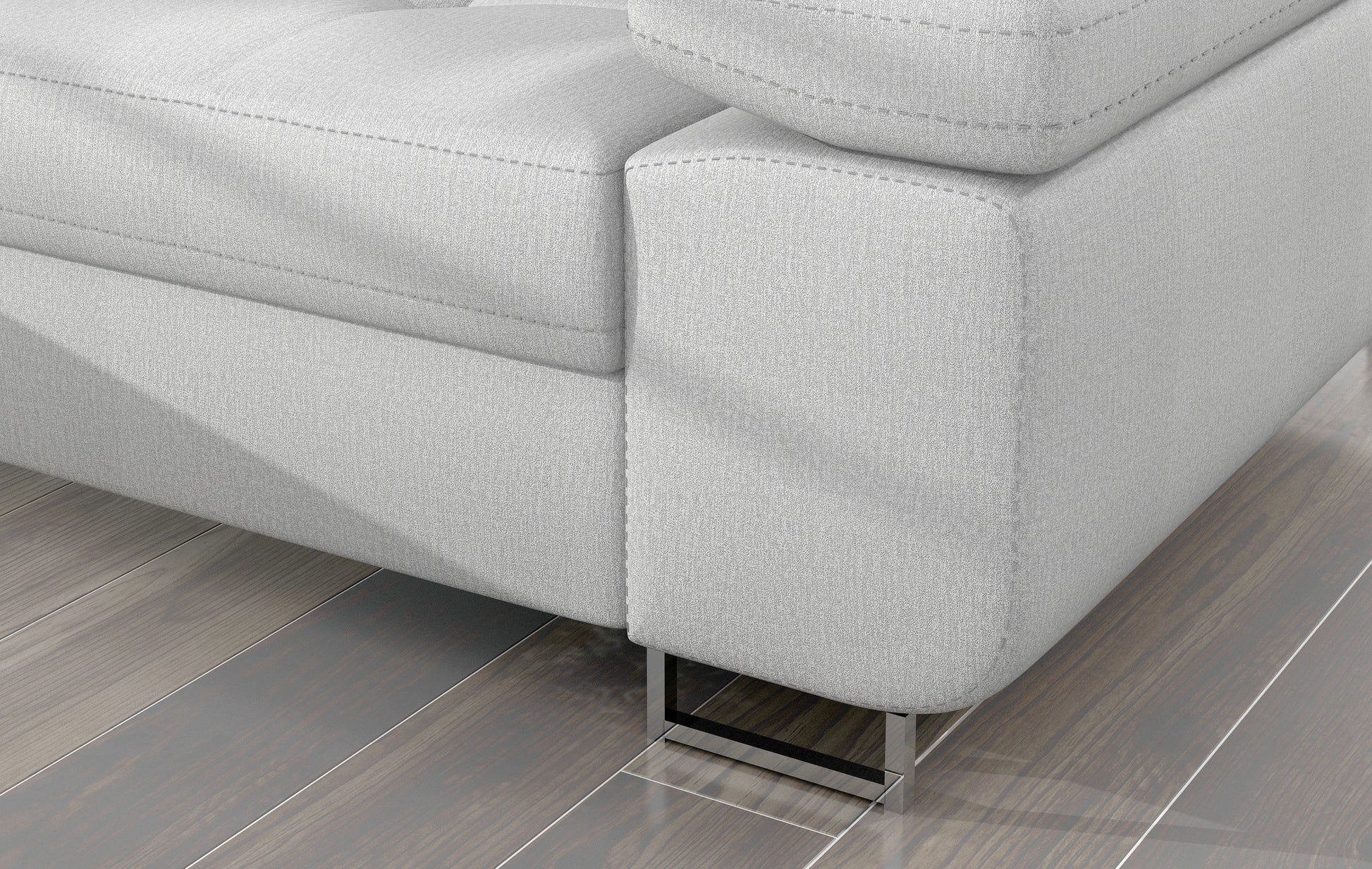 Detal narożnika Armando: jasnoszara tkanina Monolith 84 i metalowa noga – widok narożnika z perspektywy podłogi.