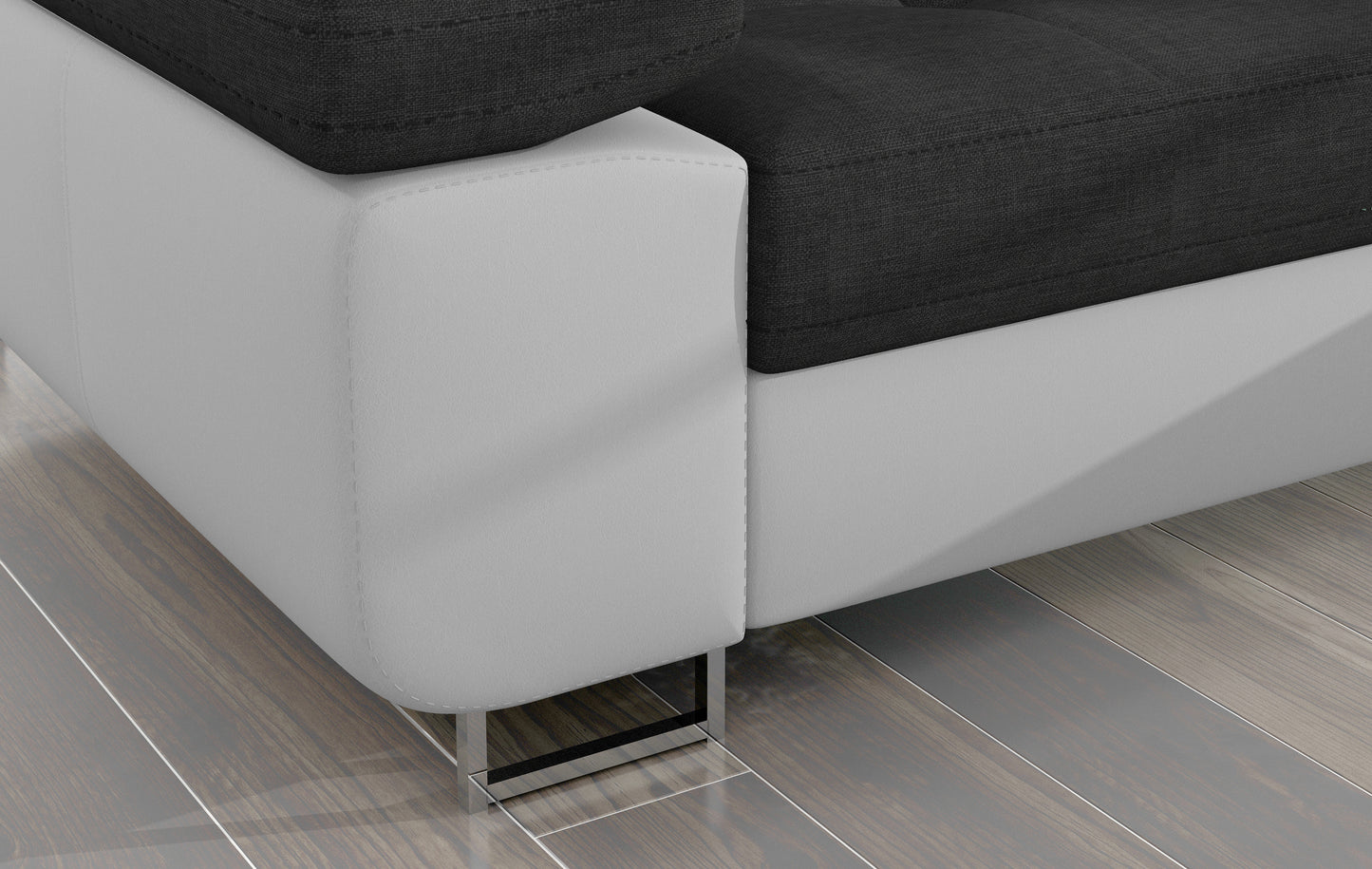 Detal narożnika Armando: biała podstawa Soft 17 i chromowana metalowa noga na tle drewnianej podłogi.