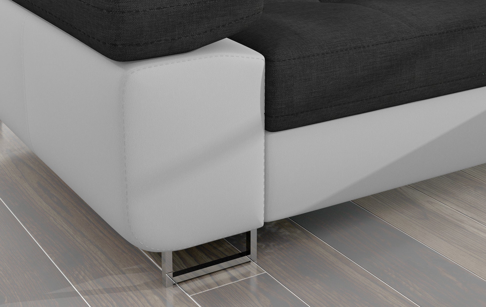 Detal narożnika Armando: biała podstawa Soft 17 i chromowana metalowa noga na tle drewnianej podłogi.