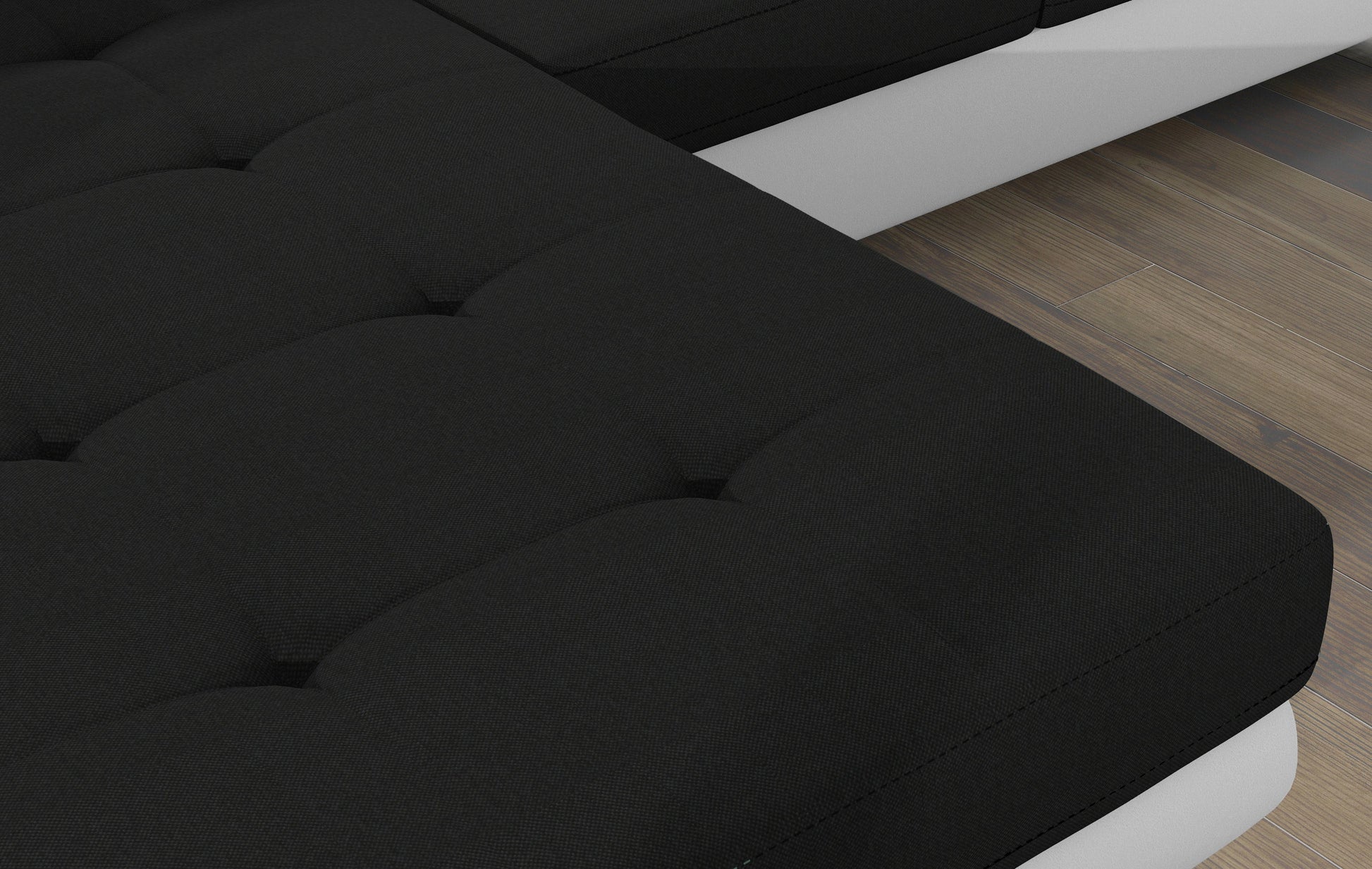 Zbliżenie na pikowane siedzisko narożnika Armando w tkaninie Sawana 14 czarny – wyraźna struktura materiału.