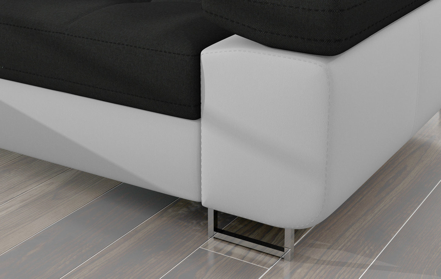 Detal narożnika Armando: czarna tkanina Sawana 14 i biała podstawa Soft 17 – widok narożnika z metalową nogą.
