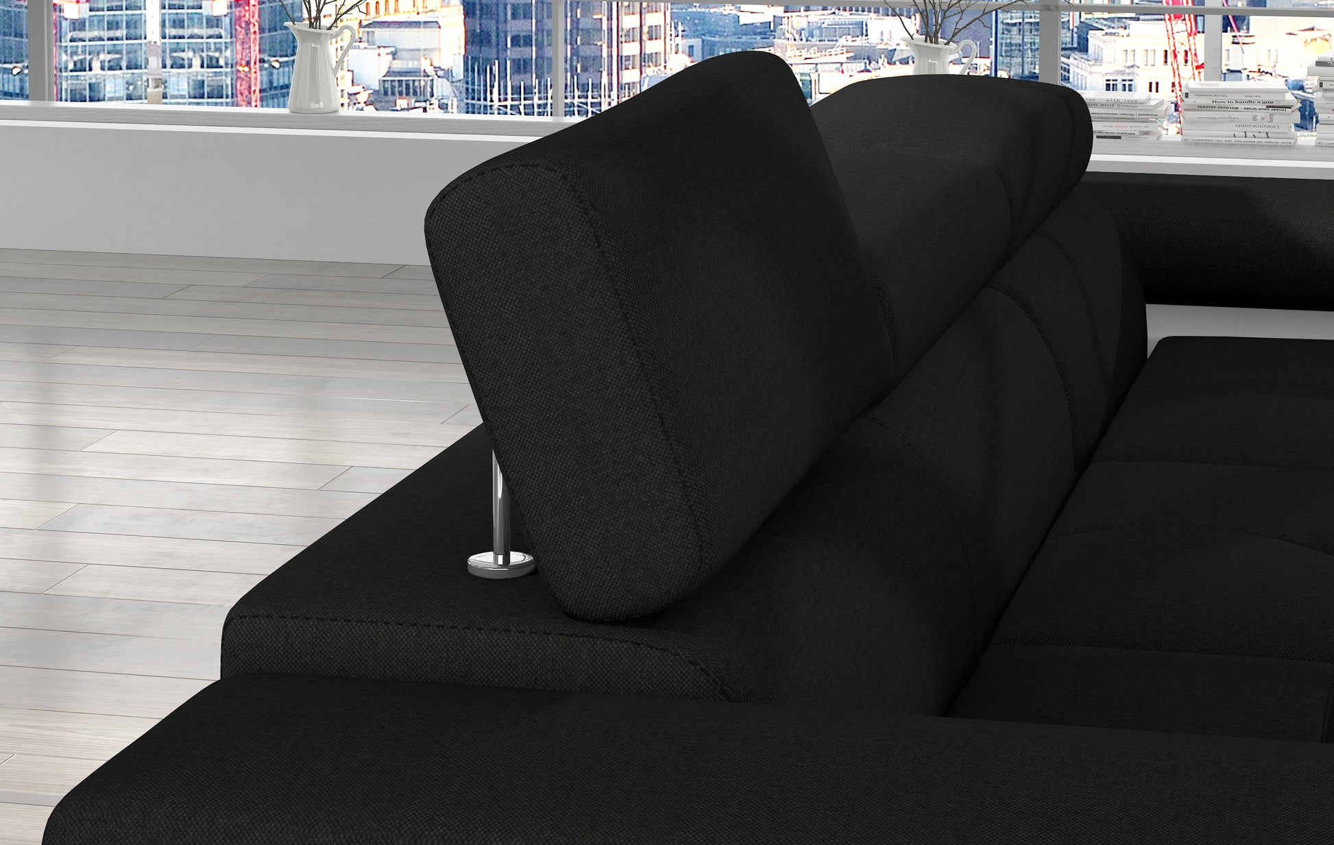 Regulowany zagłówek narożnika Armando w tkaninie Sawana 14 czarny – detal mechanizmu i miękkiego wykończenia.