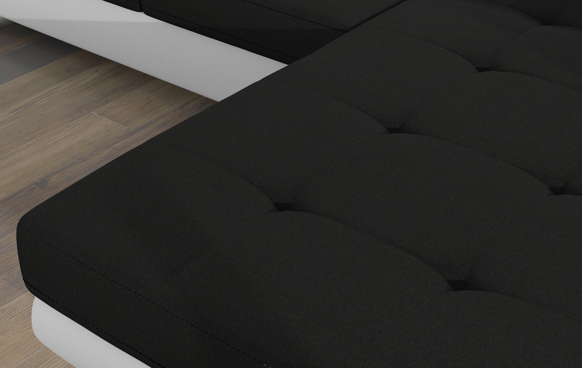 Zbliżenie na siedzisko narożnika Armando w tkaninie Sawana 14 czarny – widoczna struktura materiału i pikowanie.