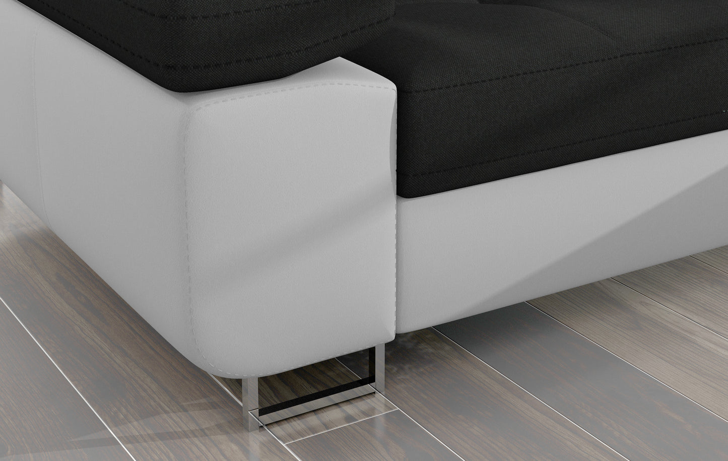 Detal narożnika Armando: biała podstawa Soft 17 i chromowana metalowa noga na tle drewnianej podłogi.