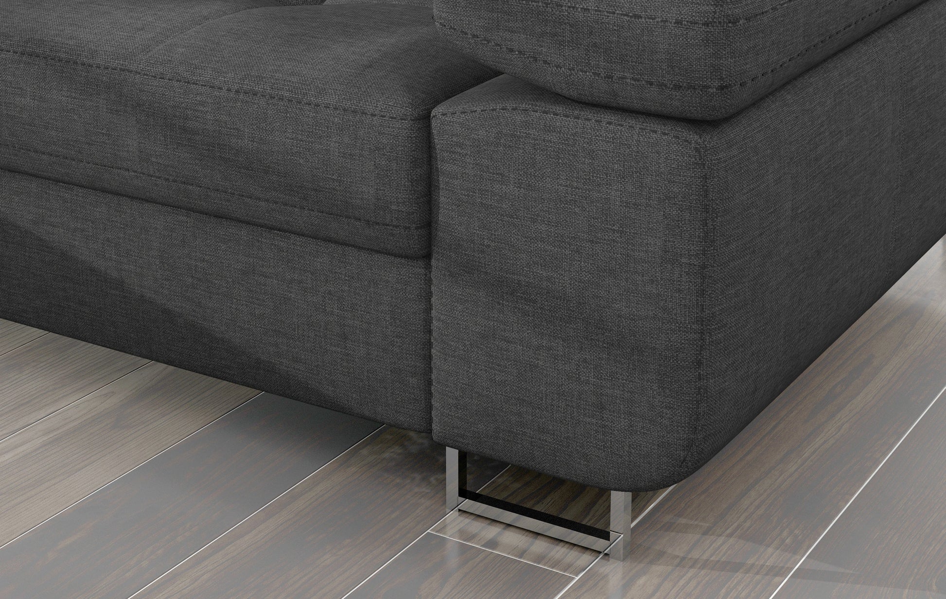 Detal narożnika Armando: szara tkanina Sawana 21 i metalowa noga – widok narożnika z perspektywy podłogi.
