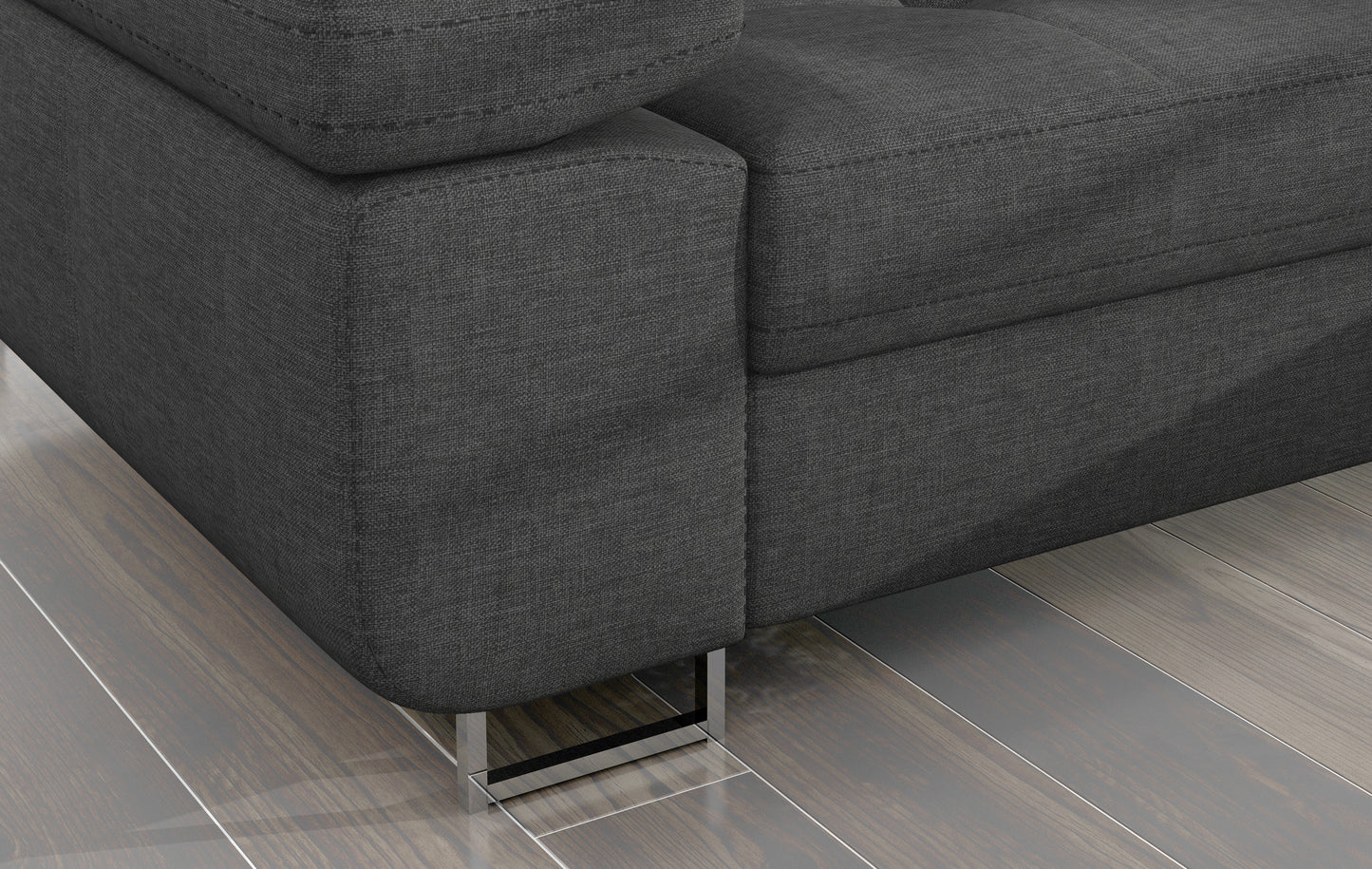 Detal narożnika Armando: szara tkanina Sawana 21 i metalowa noga – widok narożnika z perspektywy podłogi.