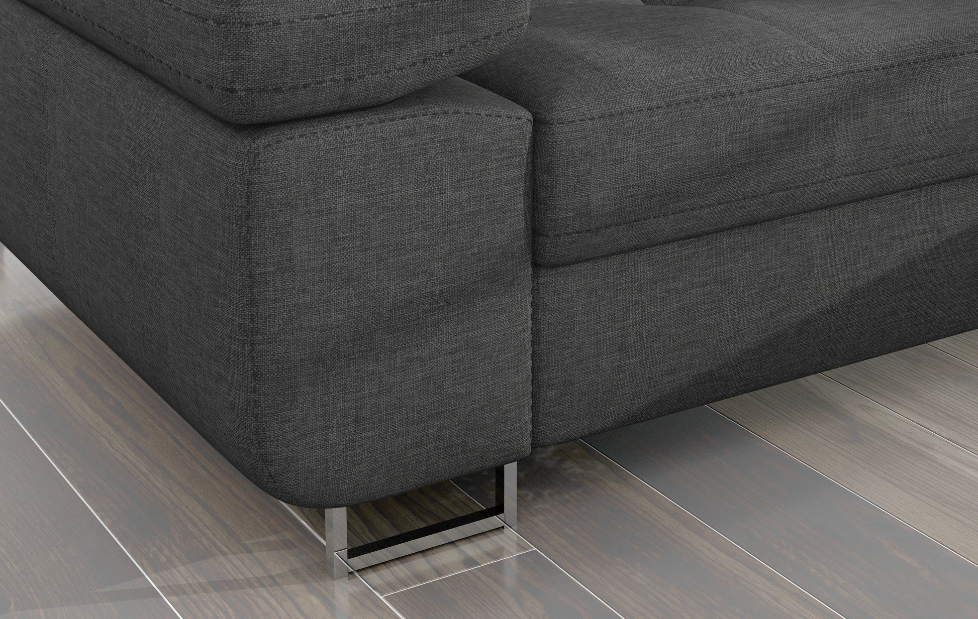 Detal narożnika Armando: szara tkanina Sawana 21 i metalowa noga – widok narożnika z perspektywy podłogi.