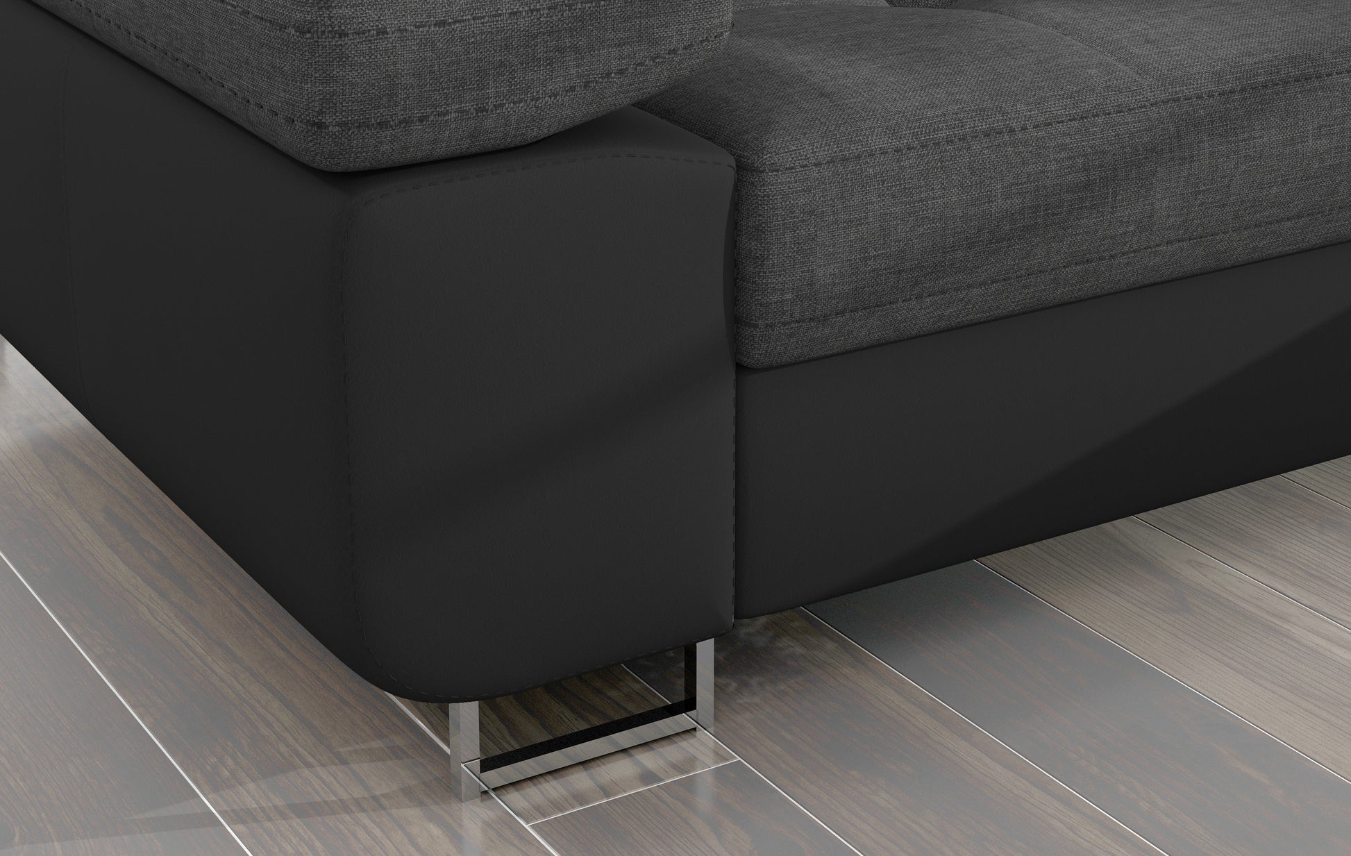 „Detal narożnika Armando: czarna podstawa Soft 11 i chromowana metalowa noga na tle drewnianej podłogi.