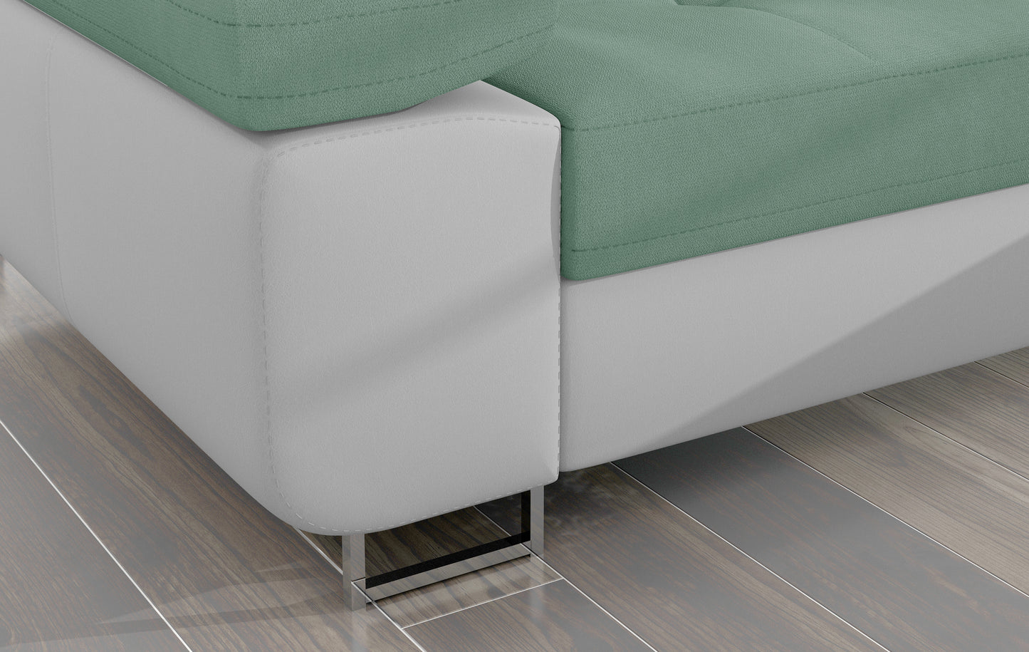 Detal narożnika Armando: biała podstawa Soft 17 i chromowana metalowa noga, kontrastująca z jasnozieloną tapicerką.