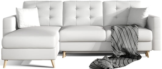 Narożnik Asgard L w kolorze Soft 17 białym – widok na sofę z uniwersalnym układem, dwoma poduszkami i dekoracyjnym kocem, na białym tle produktowym.