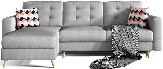 Narożnik Asgard L w kolorze Cover 87 z geometrycznymi poduszkami Zigzag 60, ciemnoszary odcień, widok z przodu na białym tle, nowoczesne wzornictwo z pikowanym oparciem i drewnianymi nogami.