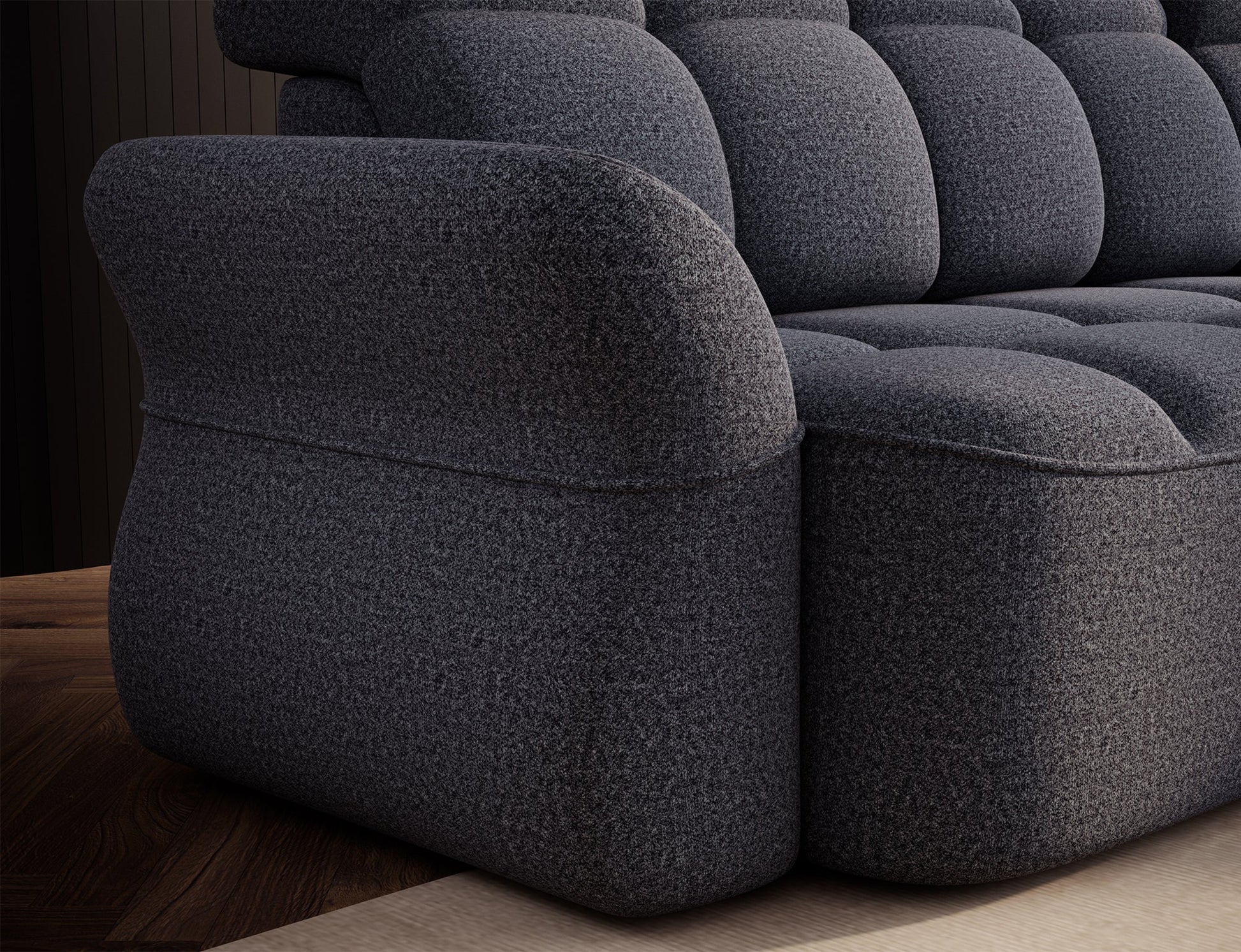 Nowoczesny narożnik w szarym odcieniu, prezentowany w różnych warunkach oświetleniowych, podkreślających jego strukturę.