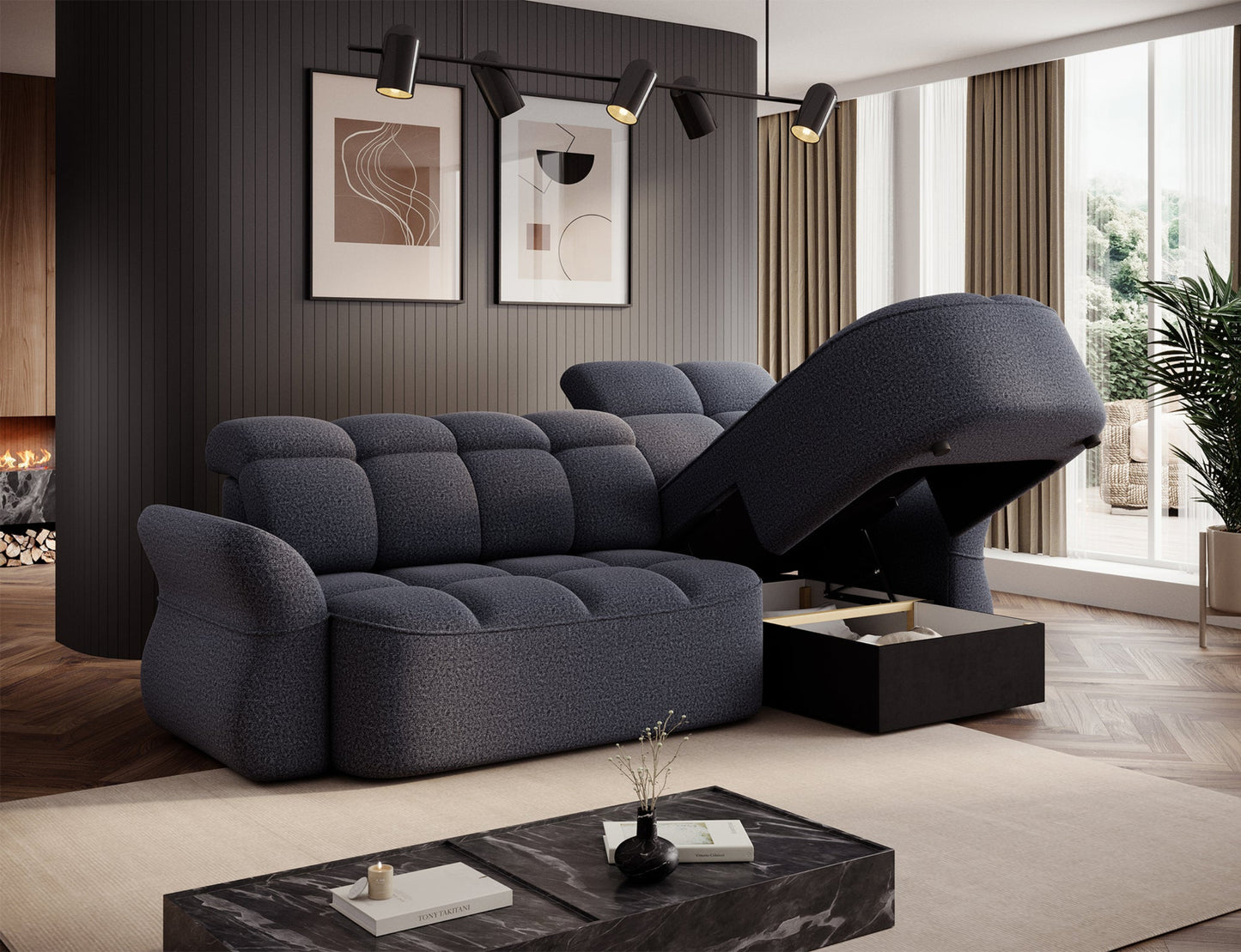 Tapicerowany podłokietnik narożnika w ciemnoszarym materiale, z zaokrąglonym, ergonomicznym kształtem dla większego komfortu.