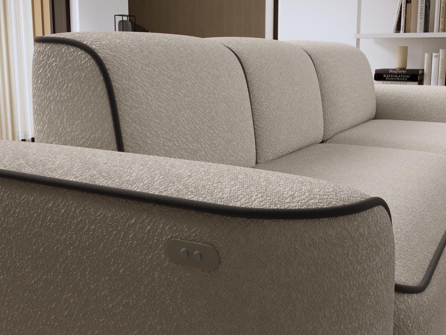 Zbliżenie na prawy podłokietnik narożnika Ume, fakturowana tapicerka bouclé w kolorze beżowym z dyskretnym panelem sterowania i brązową lamówką.