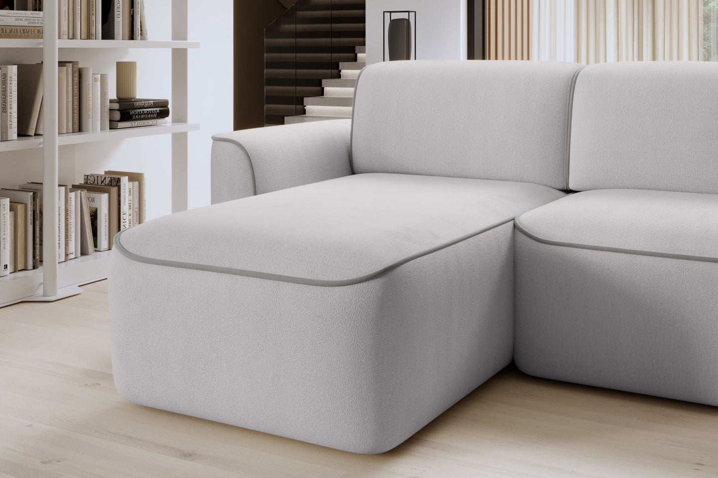 Szezlong narożnika Ume Amore 03 beżowy z lamówką Paros 05 jasnoszarą – detal miękkiego, zaokrąglonego siedziska.