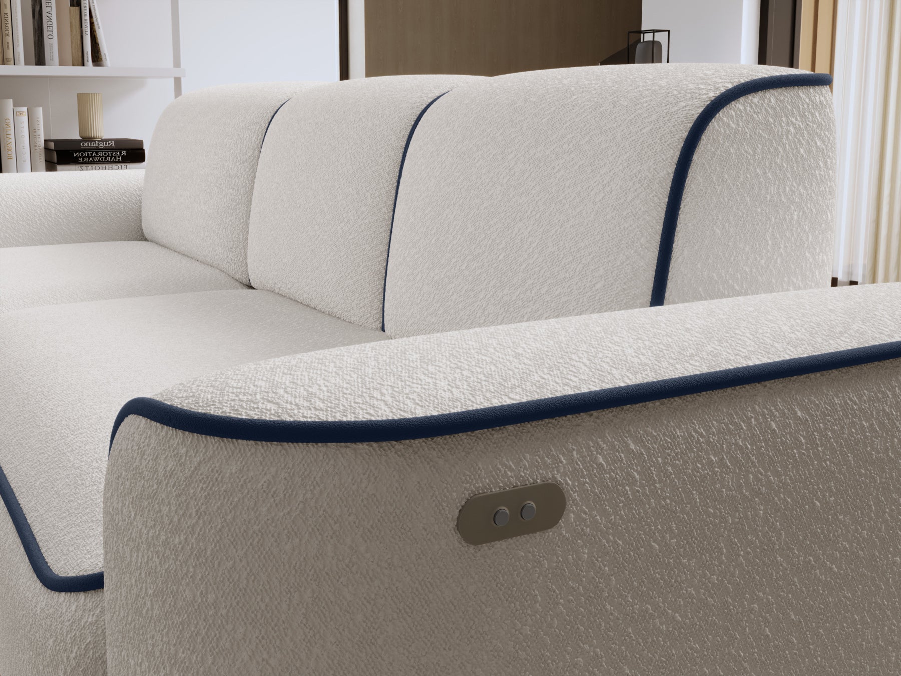 Detal oparcia i lewego boku narożnika Ume we wnętrzu, biała bouclé z granatową obwódką Velvetmat 40.