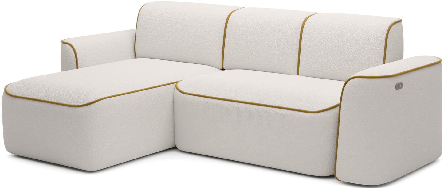 Boczny, lekko sfalowany profil narożnika Ume w układzie lewym na białym tle, fakturowana tkanina Royal 01 z lamówką Riviera 41.