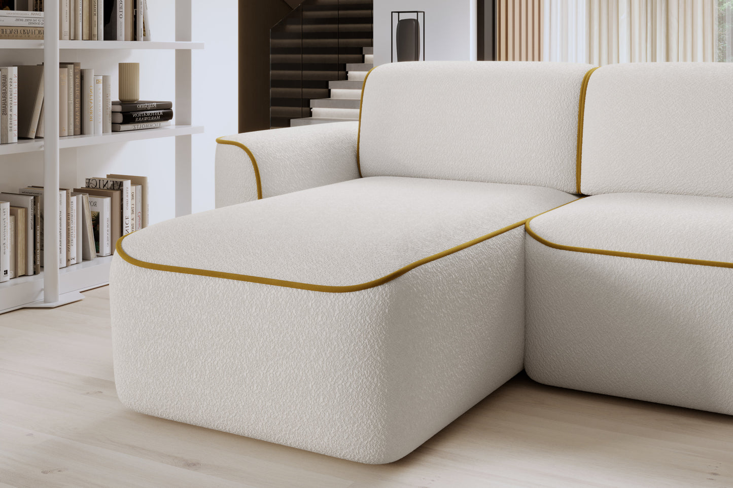 Zbliżenie na lewą otomankę narożnika Ume, zaokrąglony narożnik z fakturowaną białą tkaniną i kontrastową żółtą obwódką.