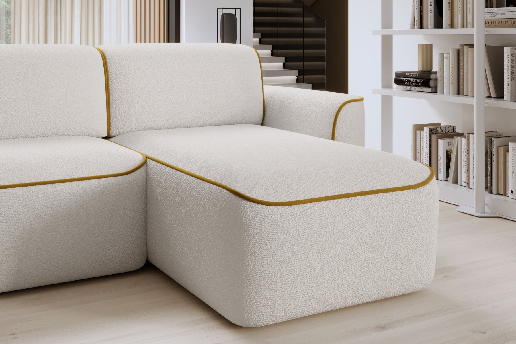 Zbliżenie na prawą otomankę sofy Ume z zaokrąglonym narożnikiem, fakturowaną białą tapicerką i kontrastową żółtą lamówką.