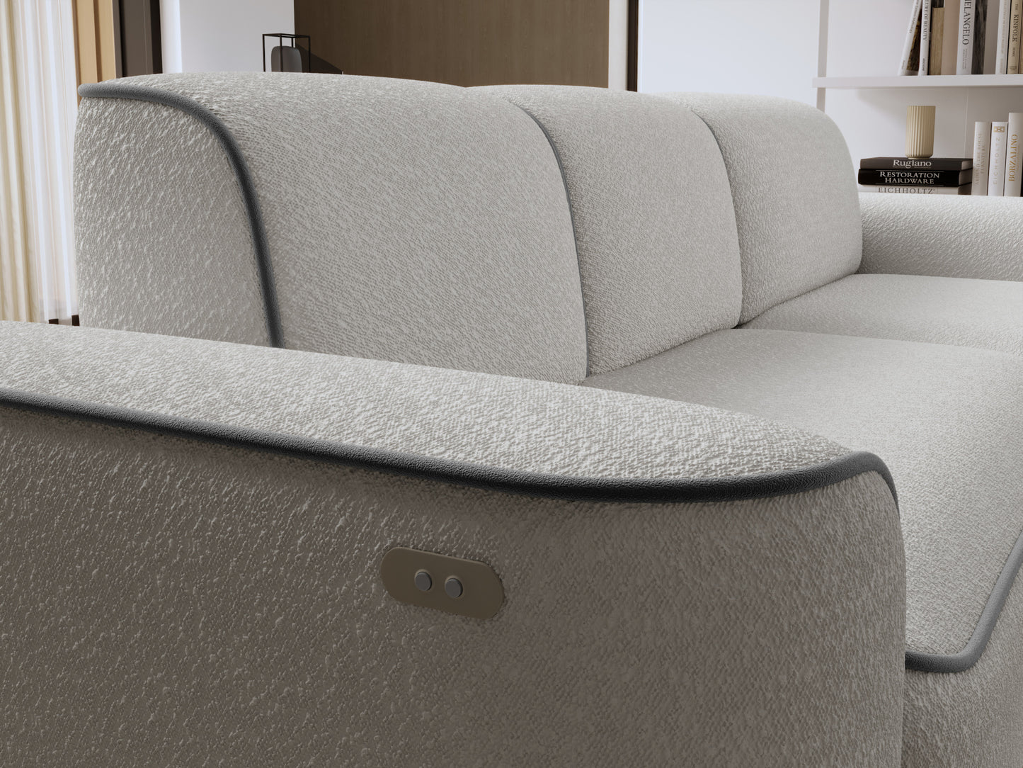 Zbliżenie na prawy podłokietnik sofy Ume z wbudowanymi przyciskami sterującymi, tapicerka Royal 03 biały i lamówka Velvetmat 04 szary.