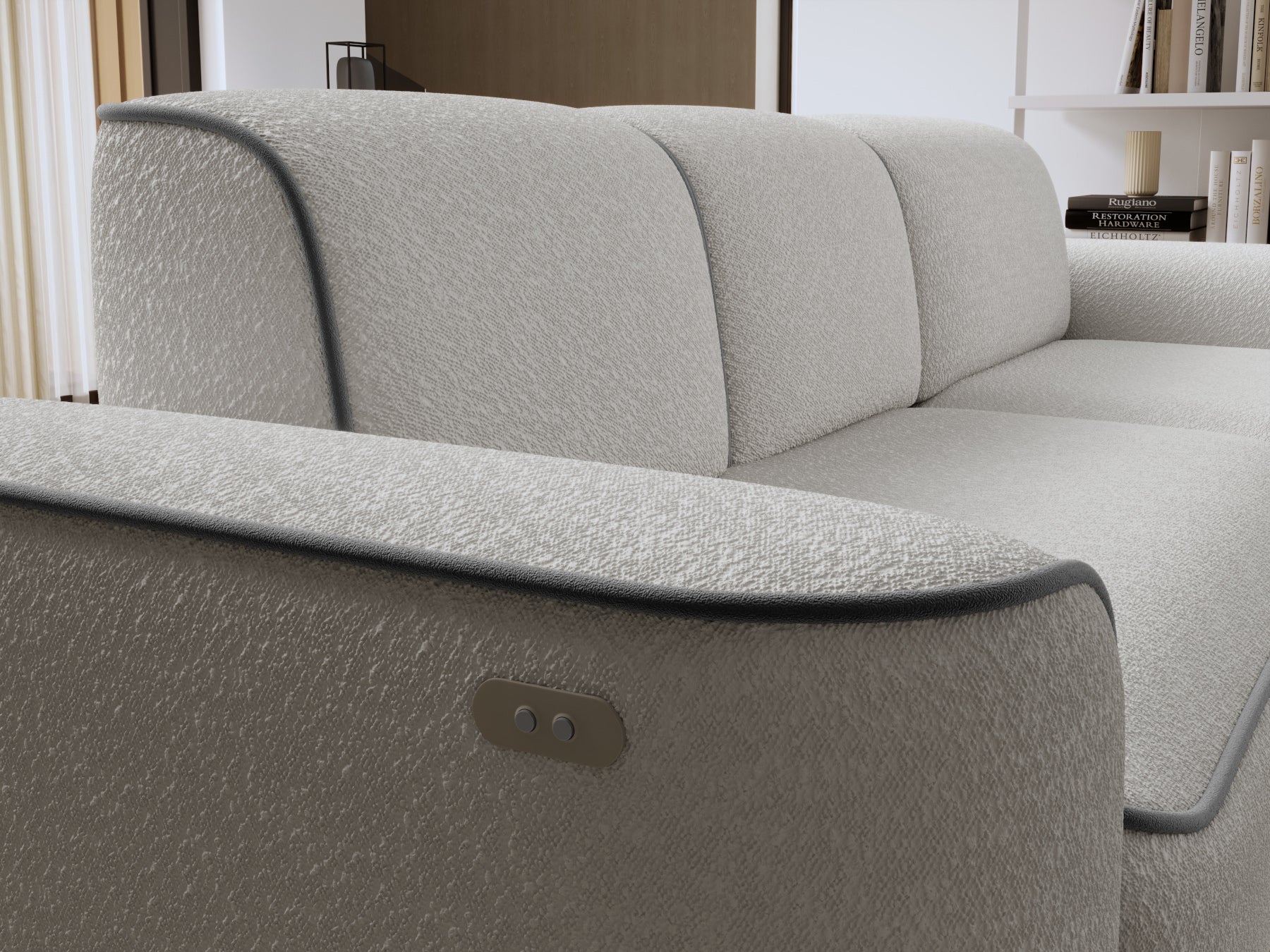 Zbliżenie na prawy podłokietnik sofy Ume z wbudowanymi przyciskami sterującymi, tapicerka Royal 03 biały i lamówka Velvetmat 04 szary.
