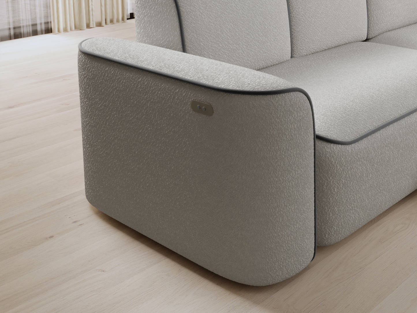 Detal prawej otomanki narożnika Ume – zaokrąglony narożnik w fakturowanej białej tkaninie z kontrastową szarą obwódką.