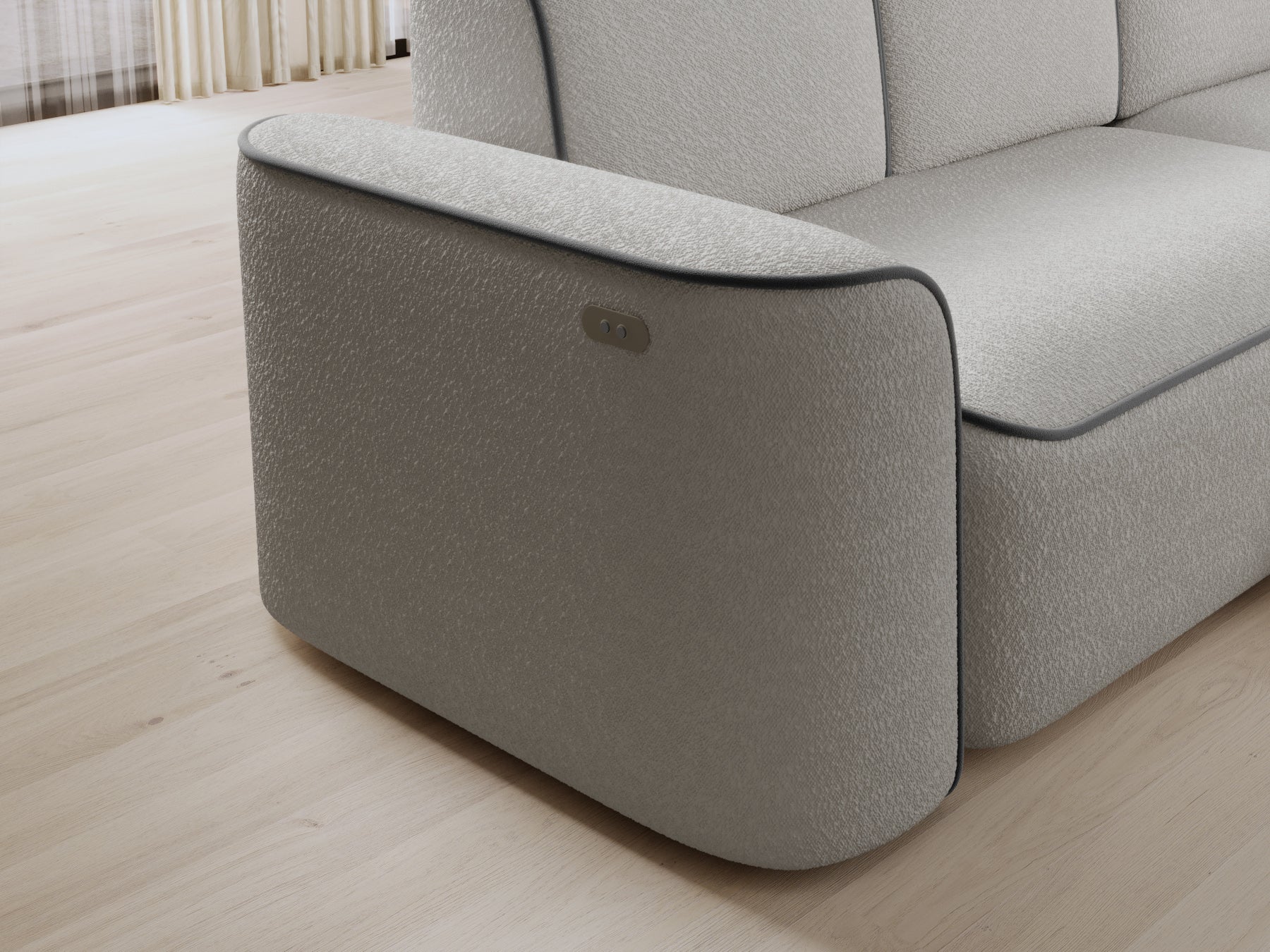 Detal prawej otomanki narożnika Ume – zaokrąglony narożnik w fakturowanej białej tkaninie z kontrastową szarą obwódką.