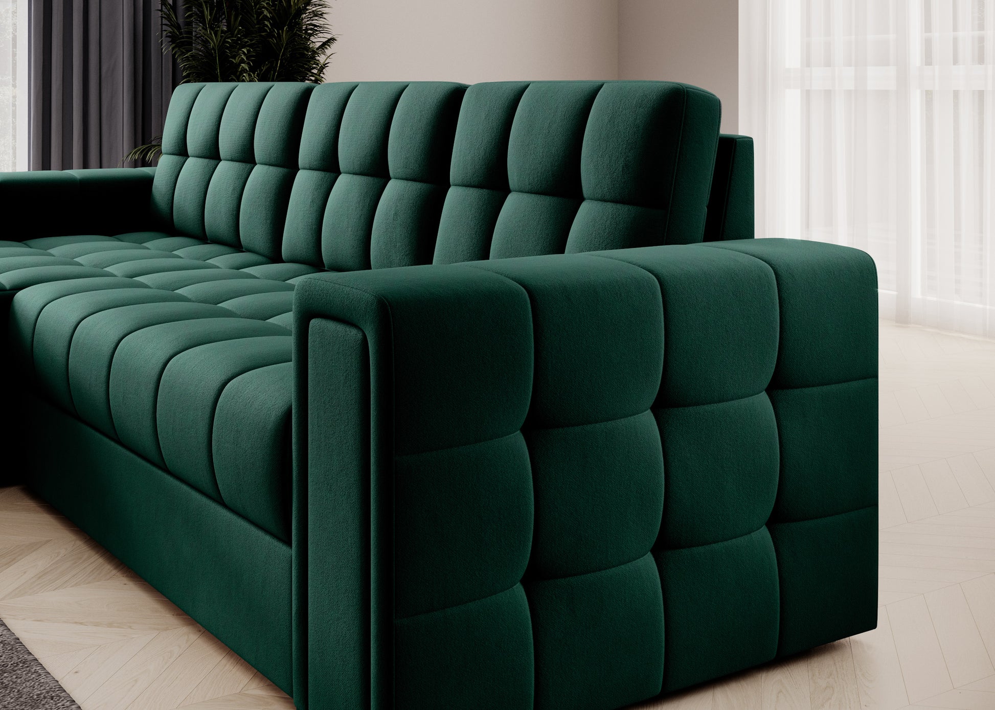 Bok narożnika Blenvi w tkaninie Lukso 35 zielony, z ozdobnym pikowaniem, miękkim siedziskiem i szerokim podłokietnikiem.