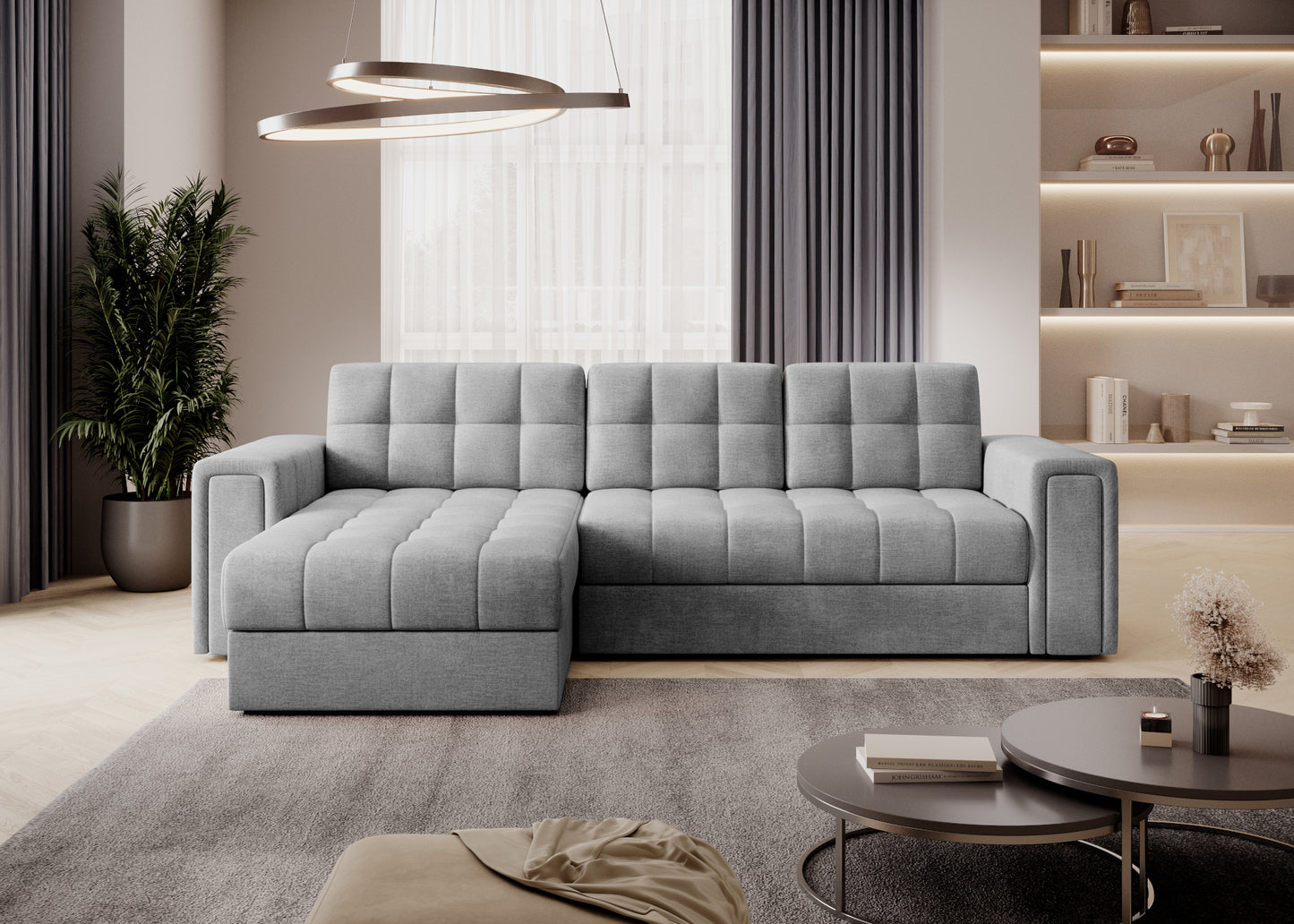 Narożnik Blenvi w tkaninie Monolith 84 jasnoszary z pikowanym siedziskiem i oparciem, ustawiony w nowoczesnym, jasnym salonie.