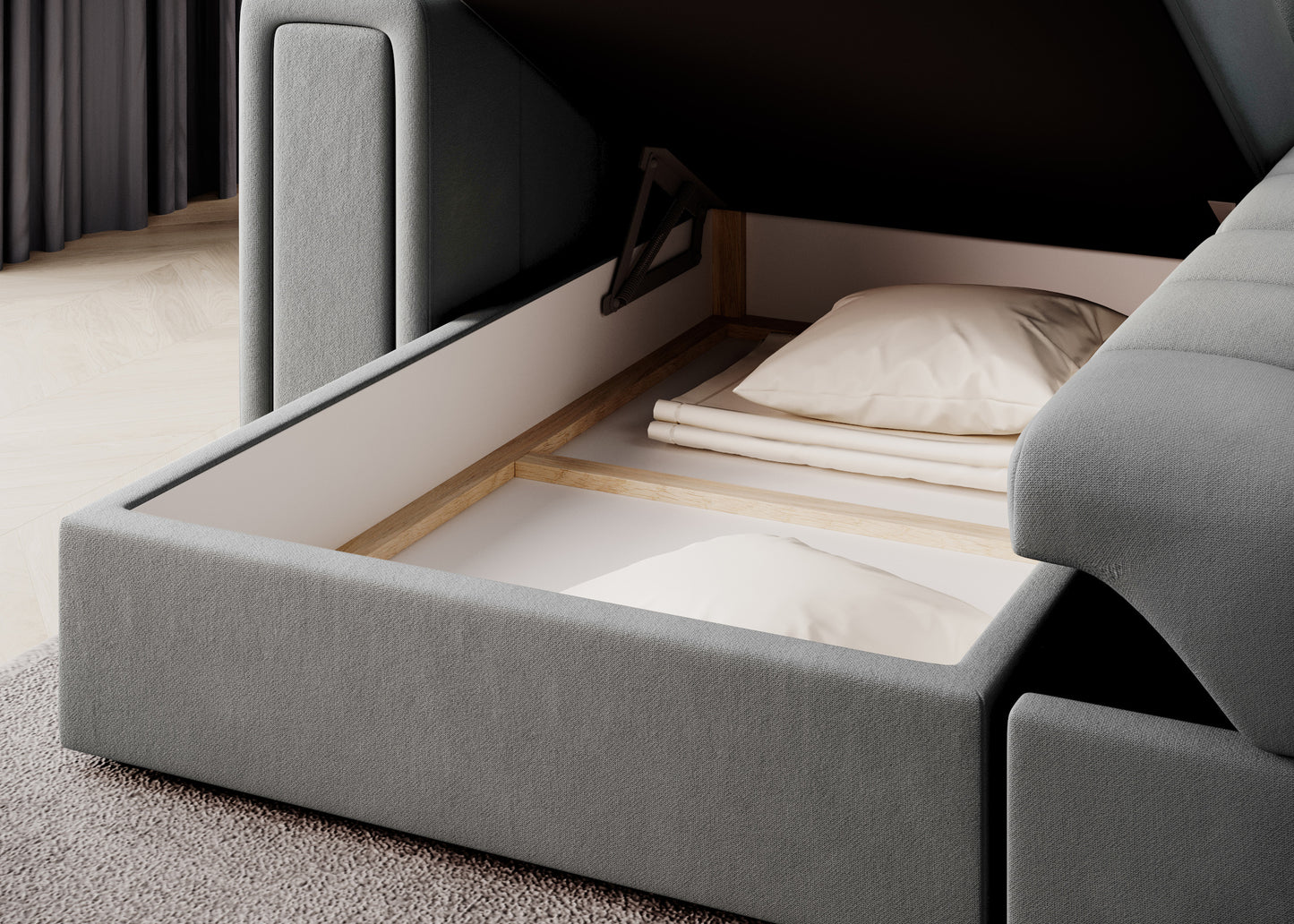 Otwarty pojemnik na pościel w szarej sofie narożnej – przestronny schowek z podnośnikiem, idealny na poduszki i koce w salonie.