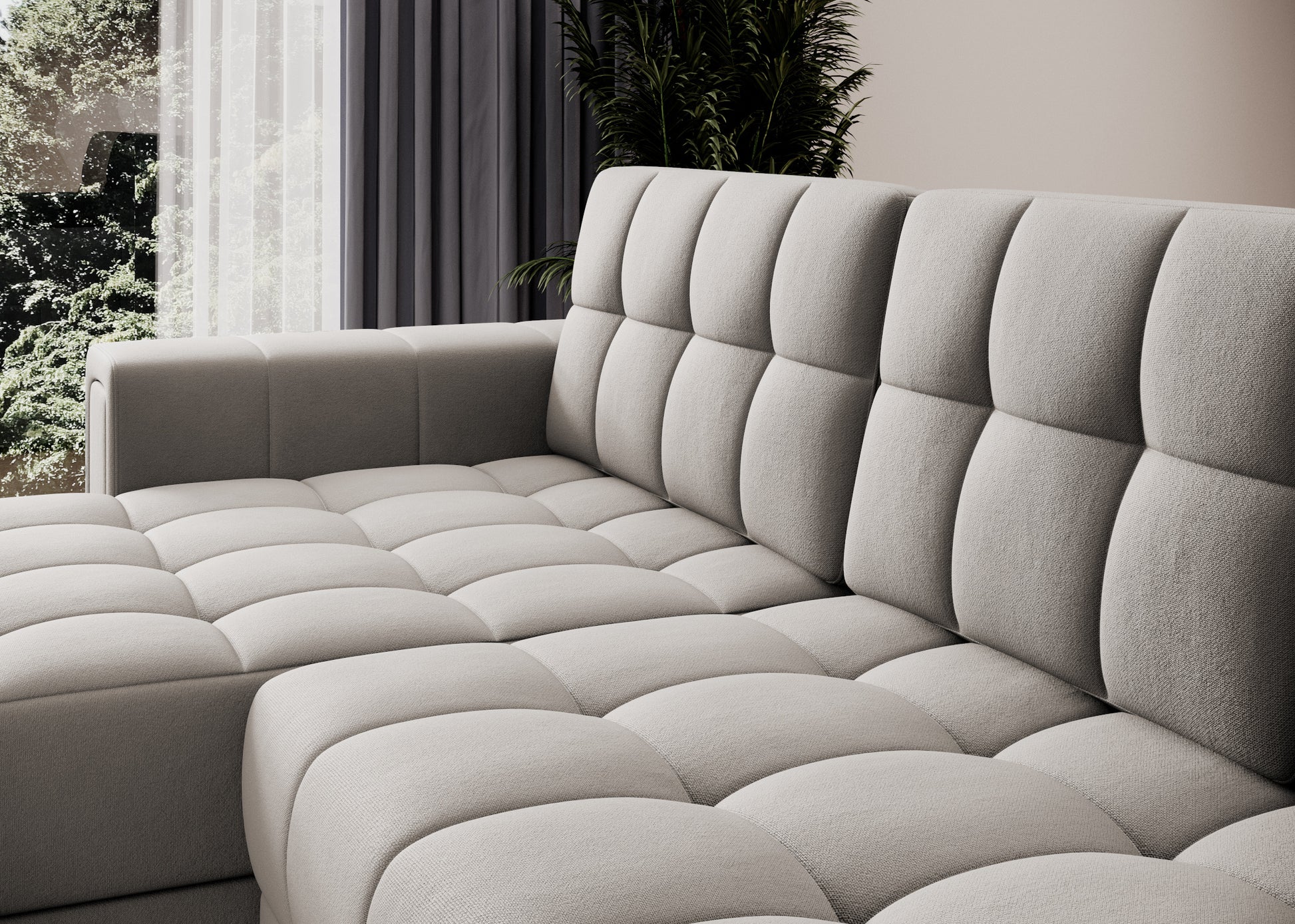 Zbliżenie na tapicerkę sofy narożnej w tkaninie Sola 18 beżowy – pikowane siedzisko i oparcie w eleganckim, nowoczesnym wnętrzu.