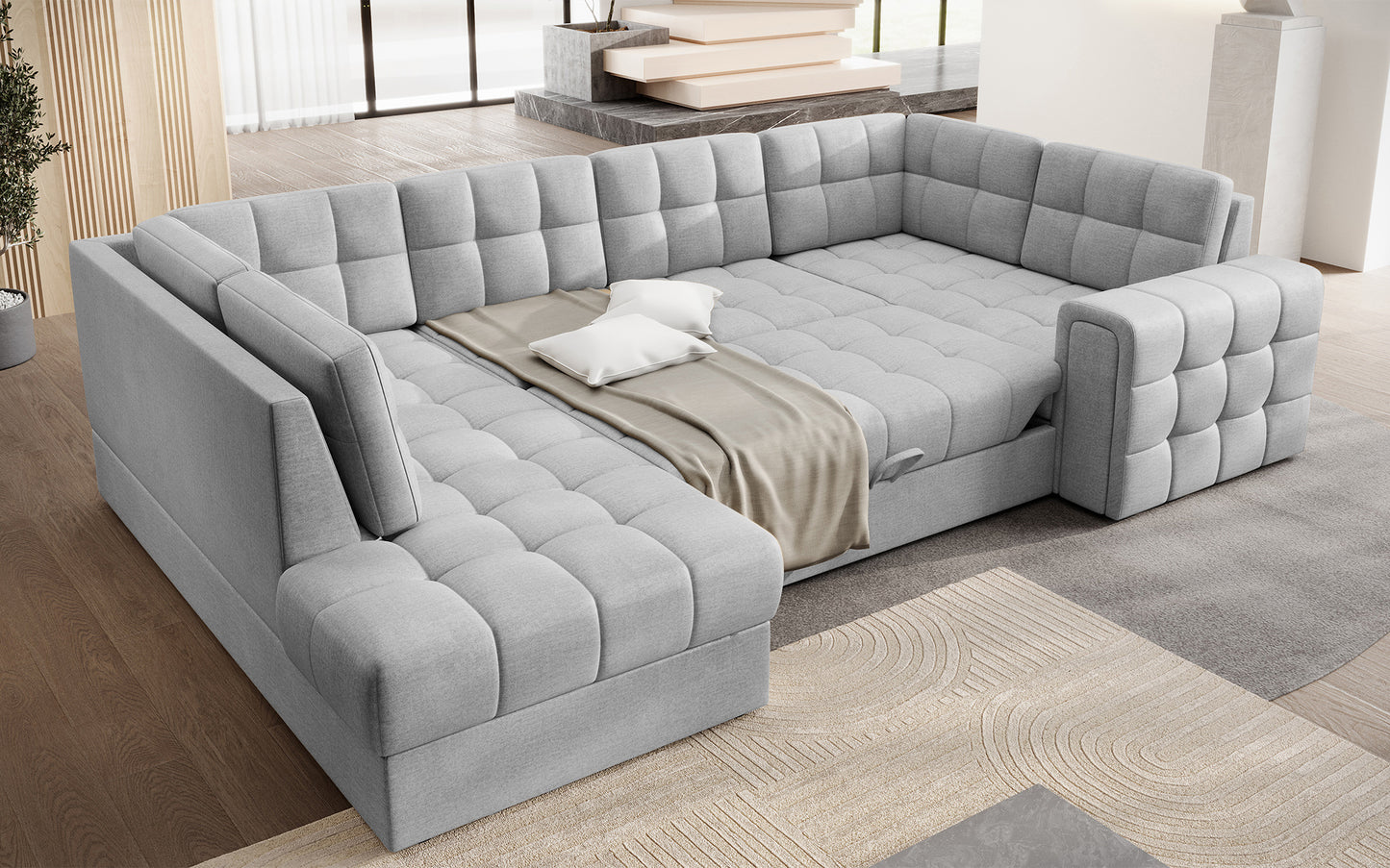 Narożnik Blewett Monolith 84 jasnoszary z funkcją spania, rozłożony w salonie. Przestronna powierzchnia i pikowana tapicerka dla komfortowego wypoczynku.