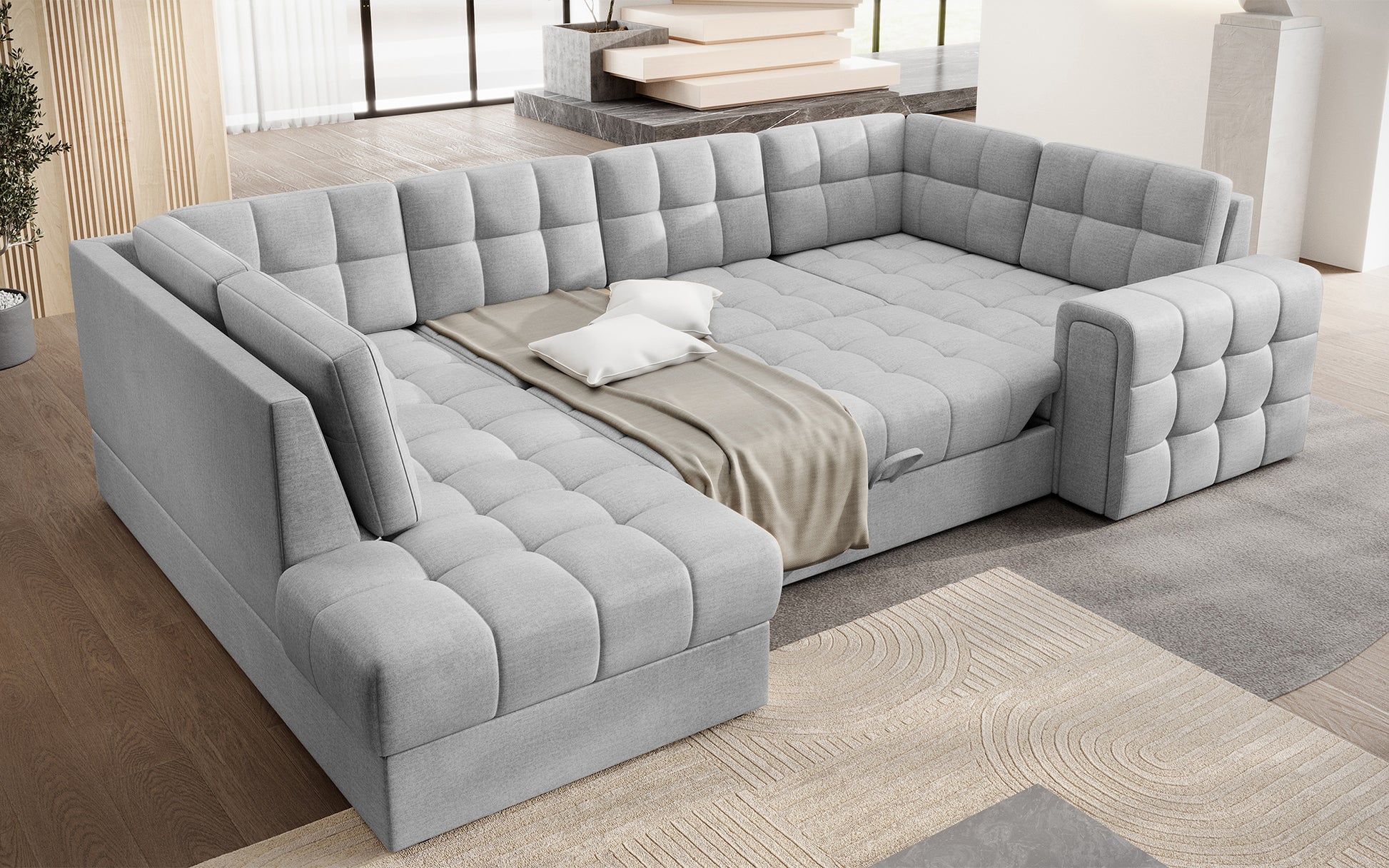 Narożnik Blewett Monolith 84 jasnoszary z funkcją spania, rozłożony w salonie. Przestronna powierzchnia i pikowana tapicerka dla komfortowego wypoczynku.