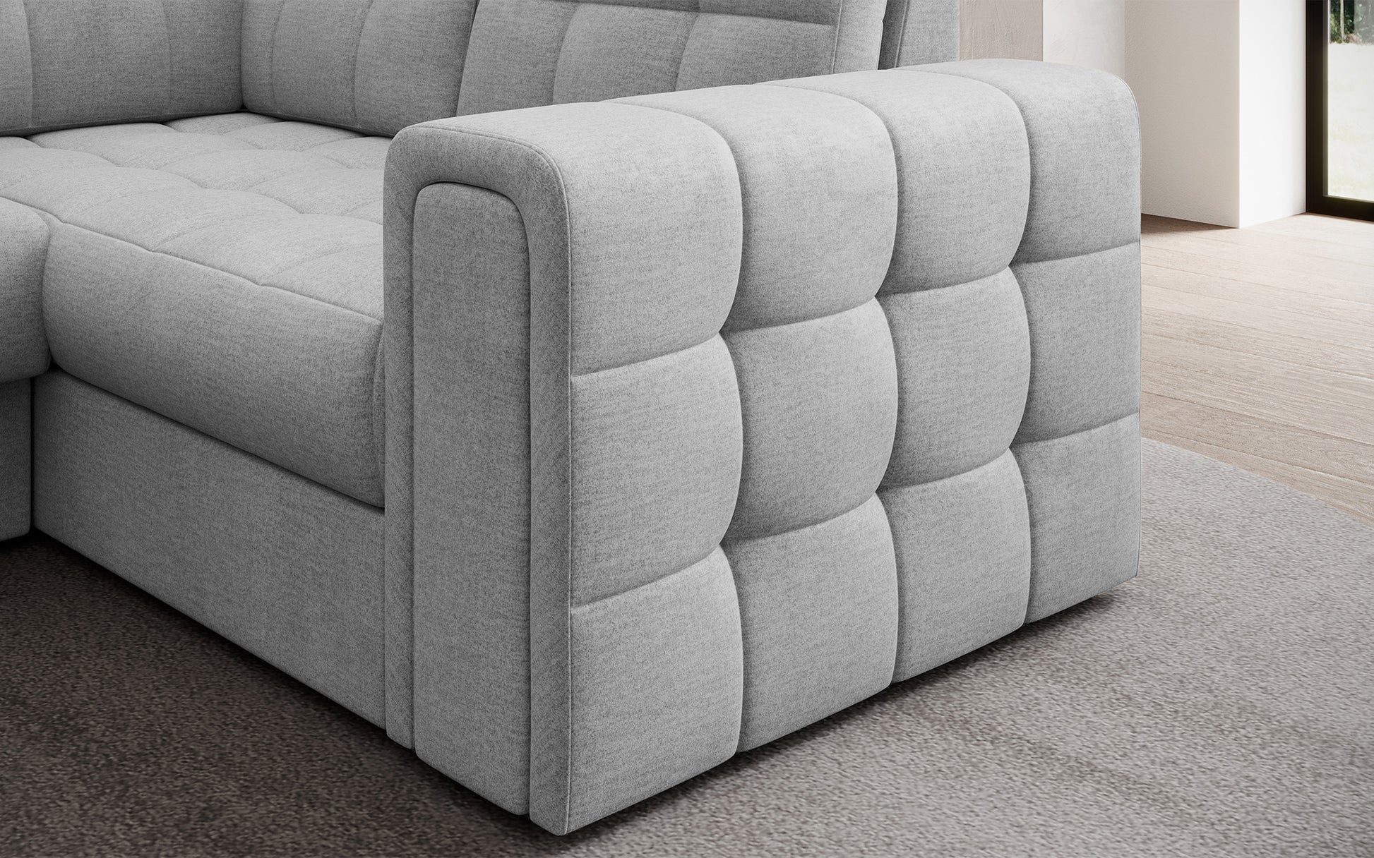 Podłokietnik narożnika Blewett Monolith 84 jasnoszary z eleganckim pikowaniem. Detal wykończenia łączący funkcjonalność i styl.