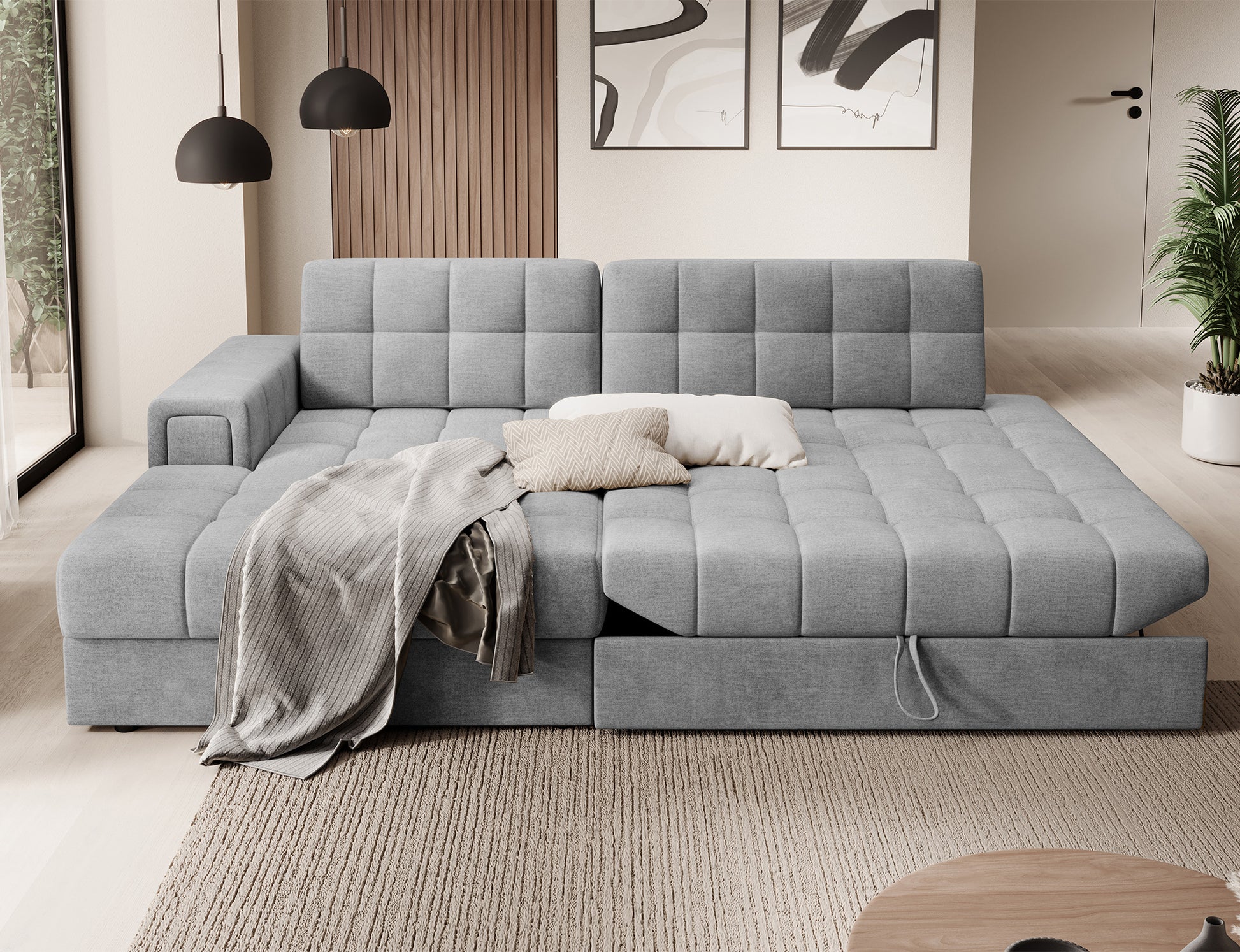 Narożnik Blezalt lewy Monolith 85 rozłożony do funkcji spania, szare pikowane siedzisko w jasnym wnętrzu z drewnianą lamelą w tle.