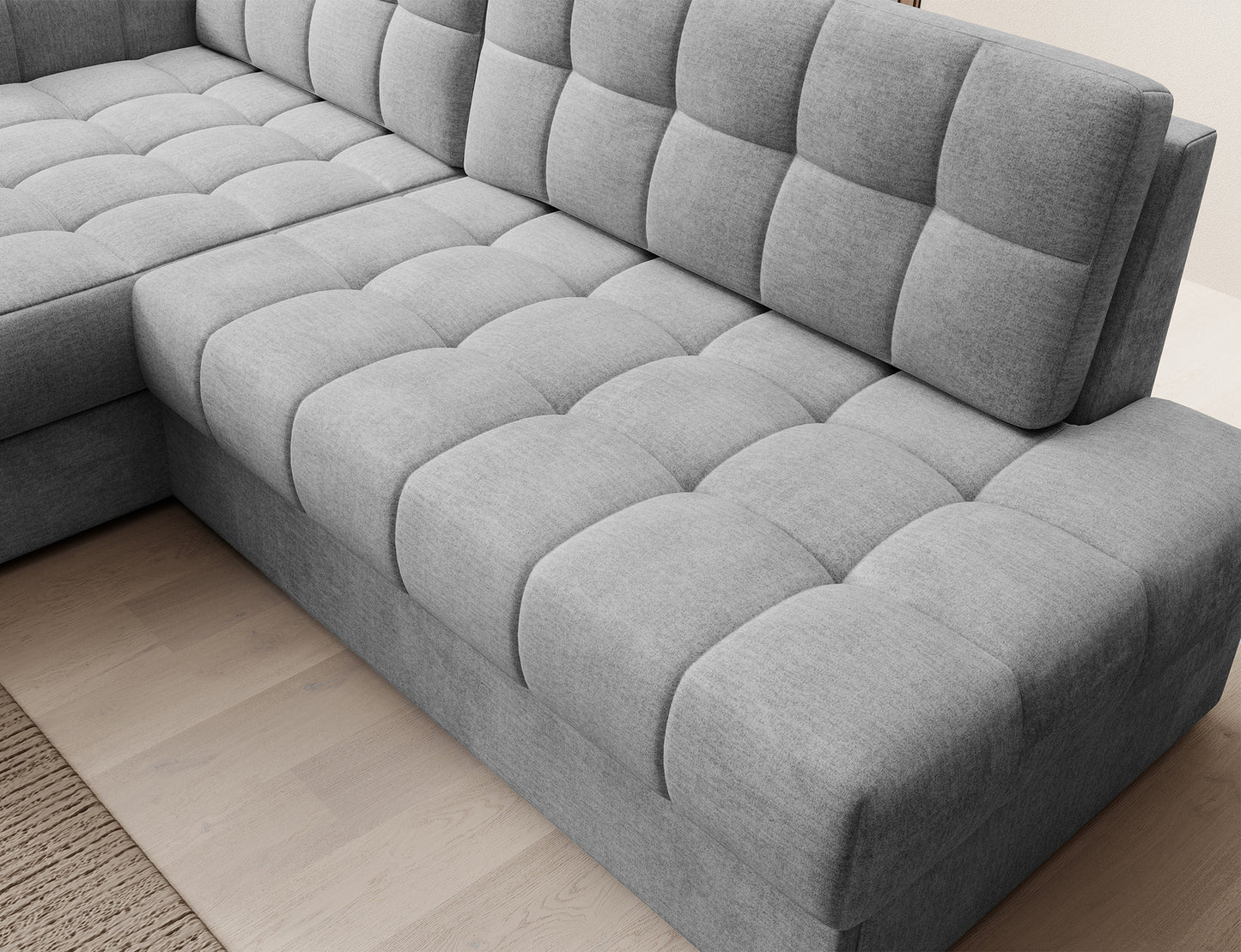 Zbliżenie na siedzisko narożnika Blezalt Monolith 85 w kolorze szarym, z widoczną pikowaną tapicerką i miękkim oparciem.