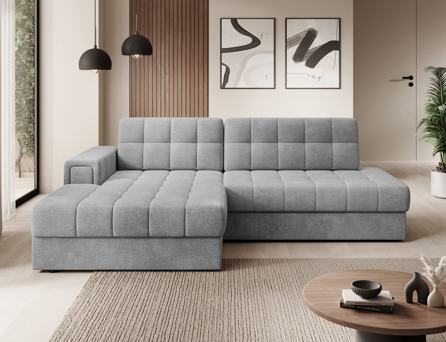 Narożnik Blezalt lewy Monolith 85 w szarym kolorze, widok od przodu, pikowane siedzisko i oparcie, nowoczesne wnętrze z dekoracjami.