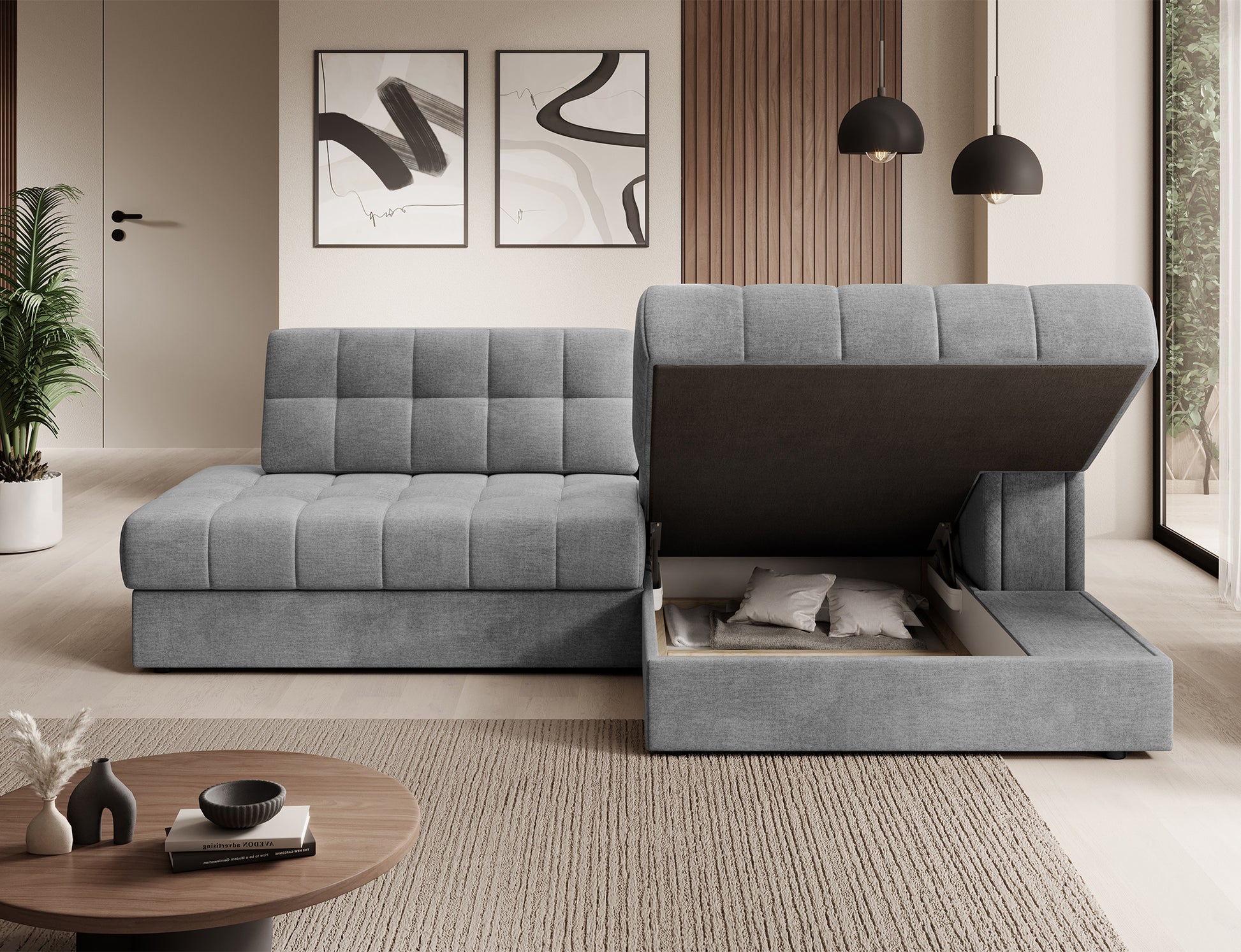 Szary narożnik Blezalt Monolith 85 prawy z otwartym pojemnikiem na pościel, uniesione siedzisko ukazuje wnętrze schowka.