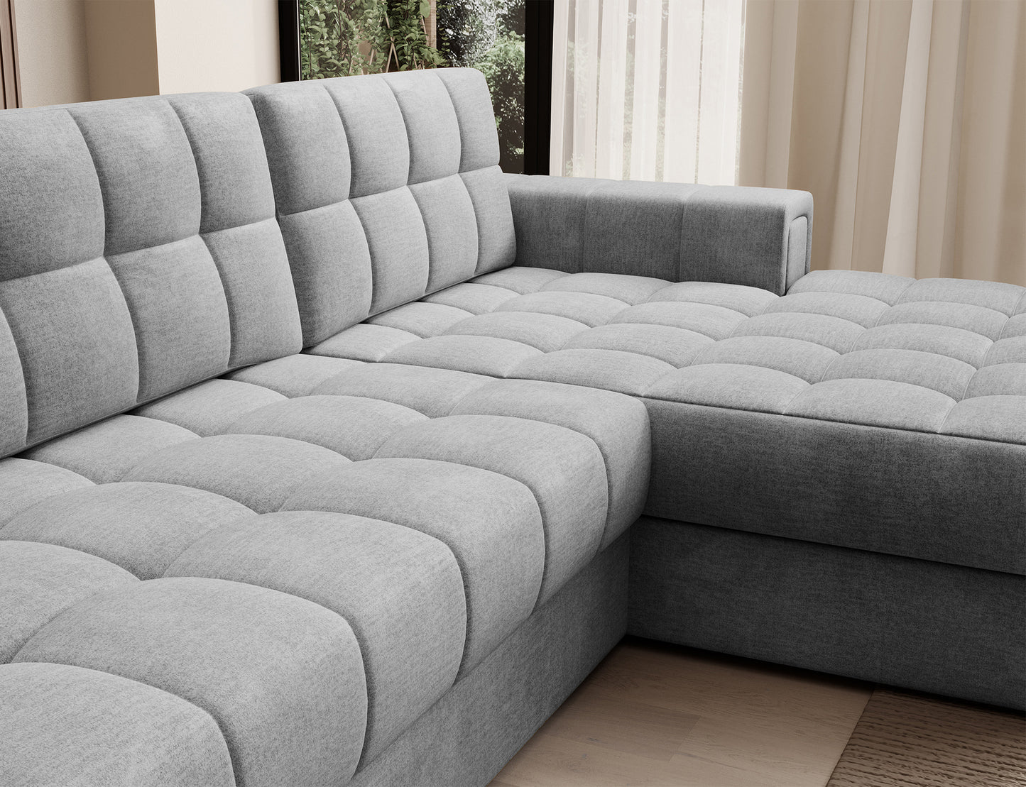 Zbliżenie na siedzisko narożnika Blezalt Monolith 85 – miękka szara tkanina z pikowaniem i zaokrąglonymi krawędziami modułów.