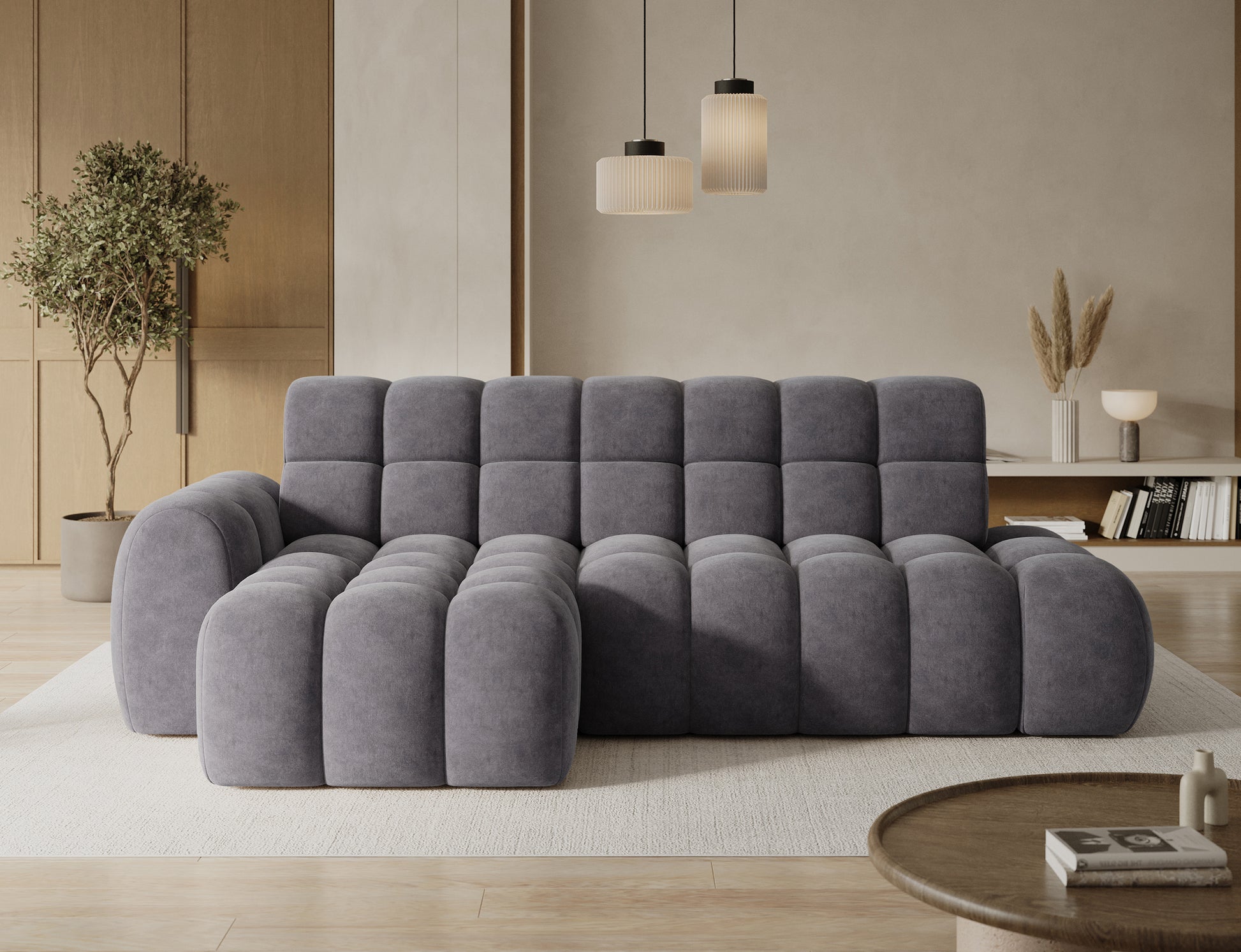 Narożnik Ceedro lewostronny w tkaninie Aura 04 szary – nowoczesny design z głębokim pikowaniem na tle jasnego, eleganckiego salonu.