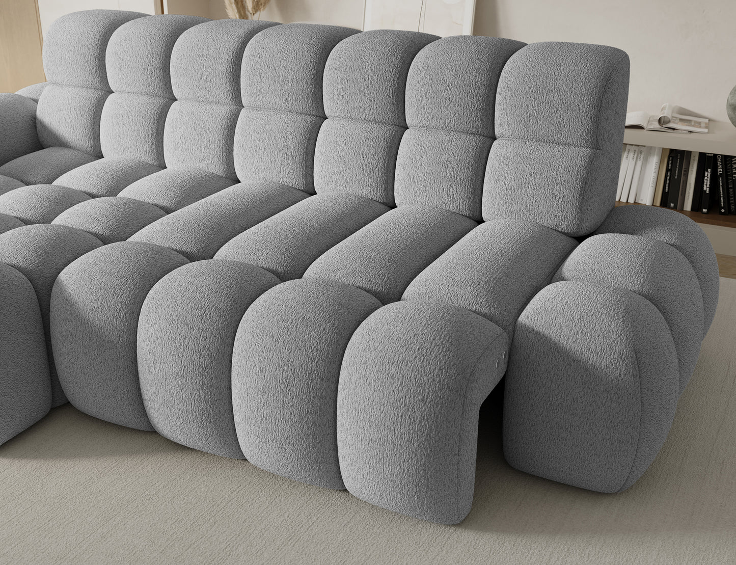 Miękkie siedzisko narożnika Ceedro Royal 04, szara tkanina boucle, modułowy układ, elegancki design i wygoda.