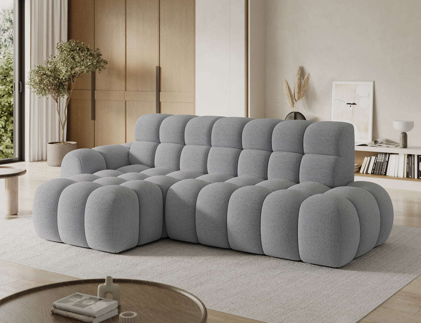 Designerski narożnik Ceedro lewy szary w eleganckim salonie — nowoczesna forma, komfort i miękkie siedziska.