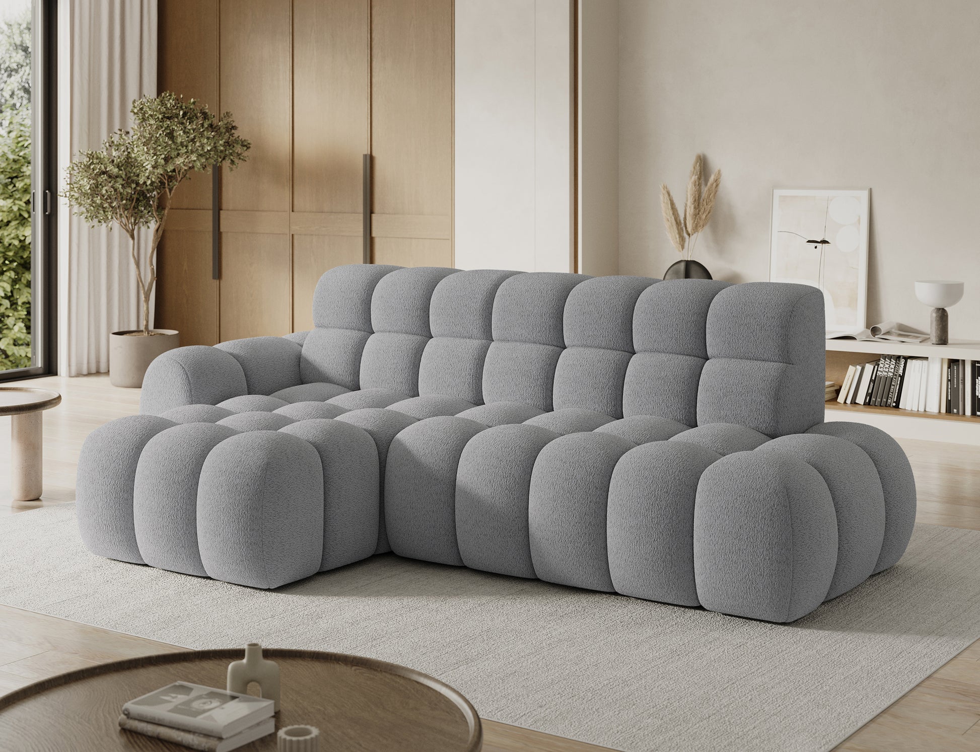Designerski narożnik Ceedro lewy szary w eleganckim salonie — nowoczesna forma, komfort i miękkie siedziska.
