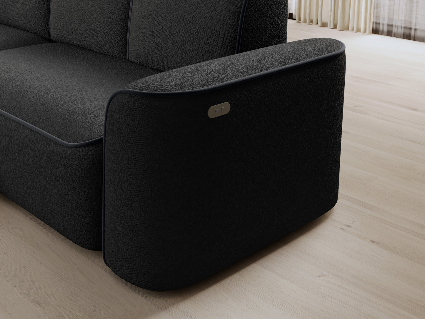 Detal oparcia i bocznej części narożnika Ume w układzie lewym, czarne bouclé uzupełnione elegancką lamówką Velvetmat 06 ciemnoszary.